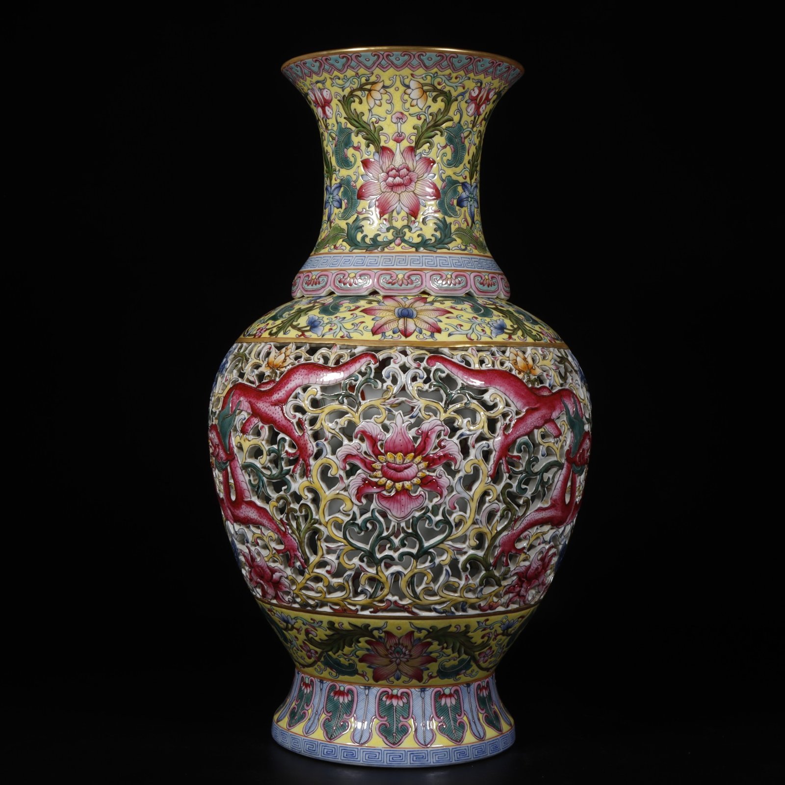 Qing Dynasty Qianlong yellow ground pastel painted gold-wrapped lotus flower hollow chilong revolving vase