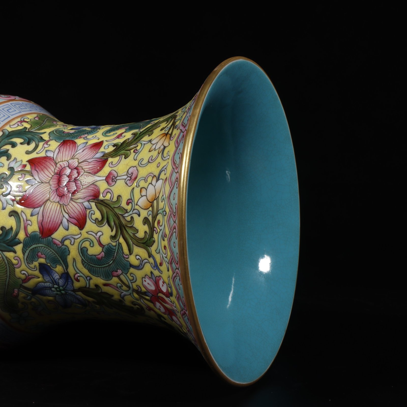 Qing Dynasty Qianlong yellow ground pastel painted gold-wrapped lotus flower hollow chilong revolving vase