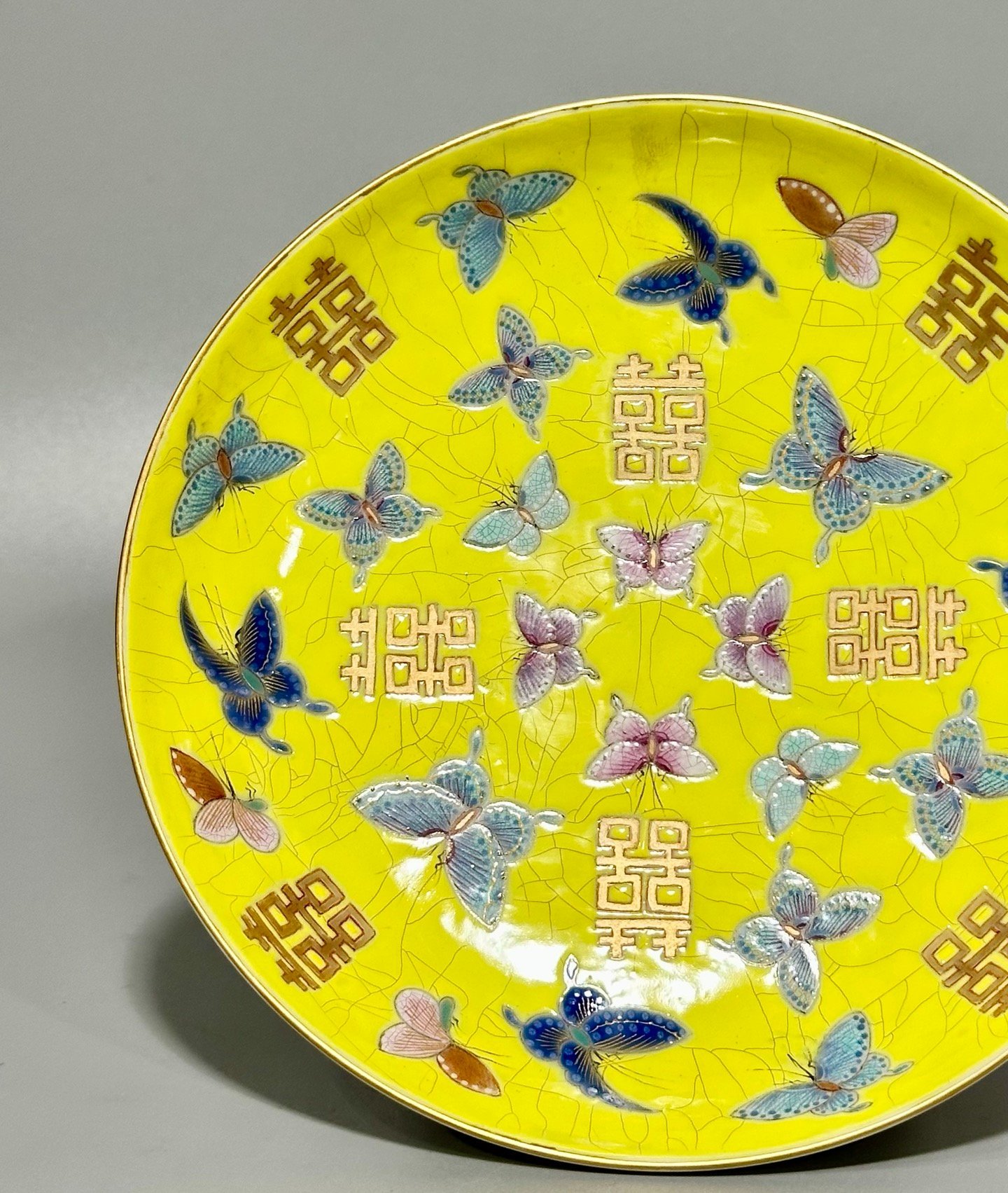 Qing Dynasty official kiln yellow ground pastel butterfly wedding plate