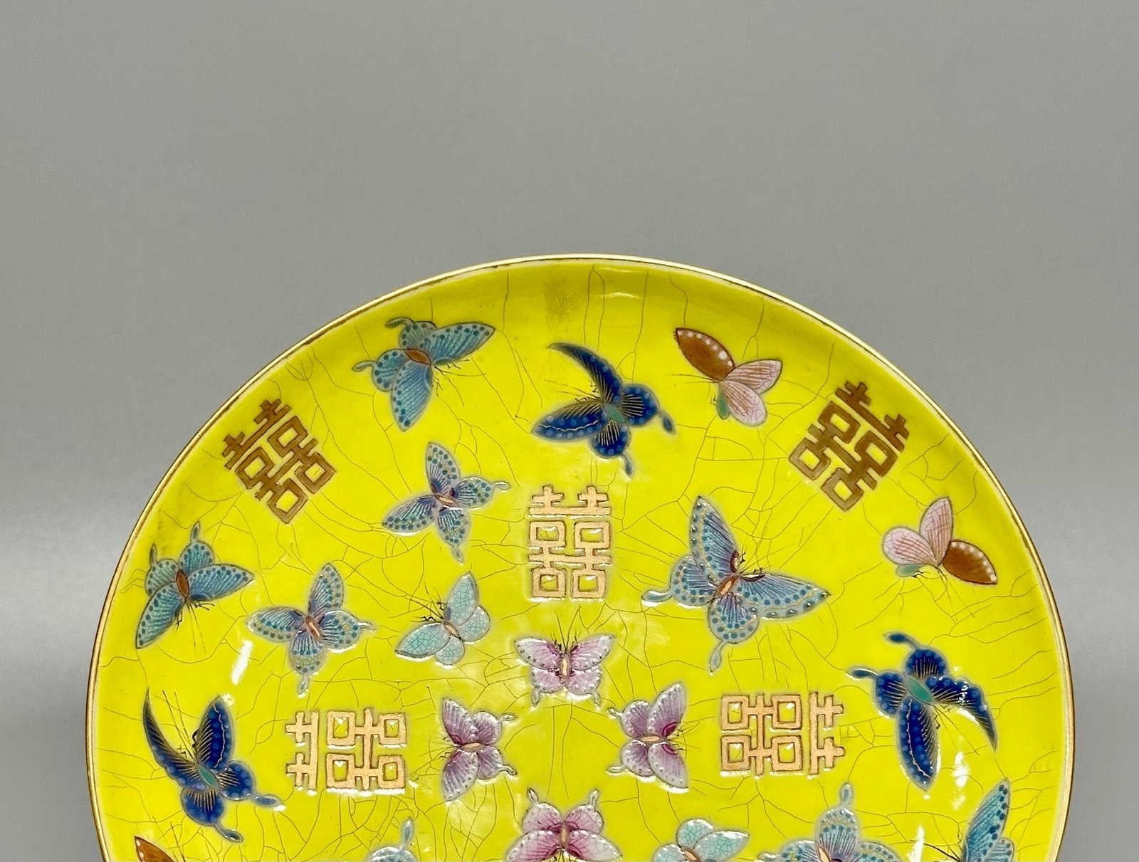 Qing Dynasty official kiln yellow ground pastel butterfly wedding plate