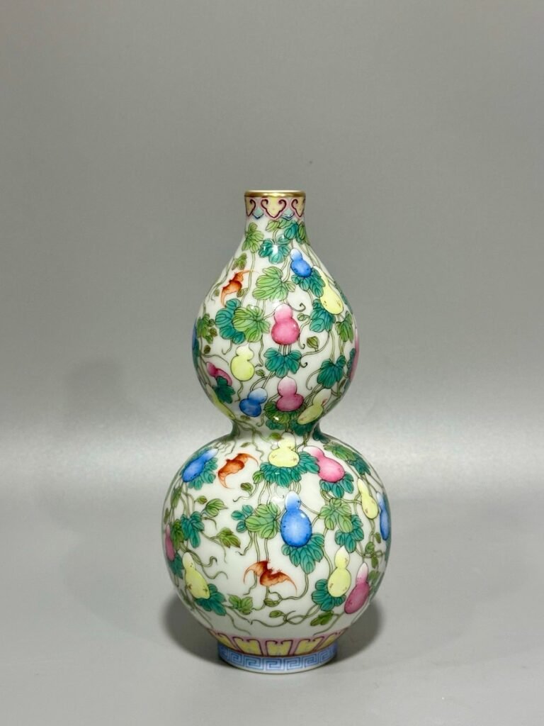 Qing Dynasty Qianlong pastel colored Fu Lu Shou gourd vase