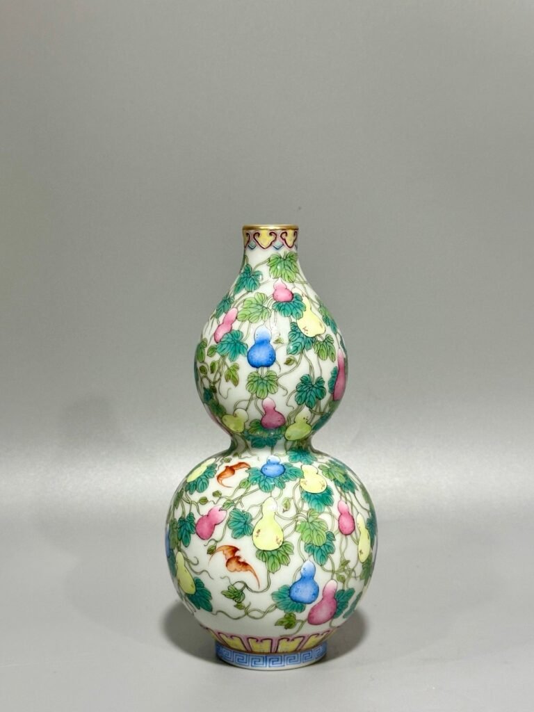 Qing Dynasty Qianlong pastel colored Fu Lu Shou gourd vase