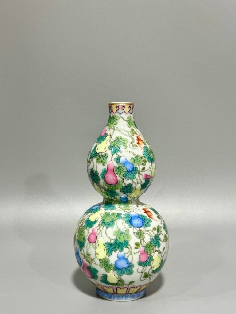 Qing Dynasty Qianlong pastel colored Fu Lu Shou gourd vase