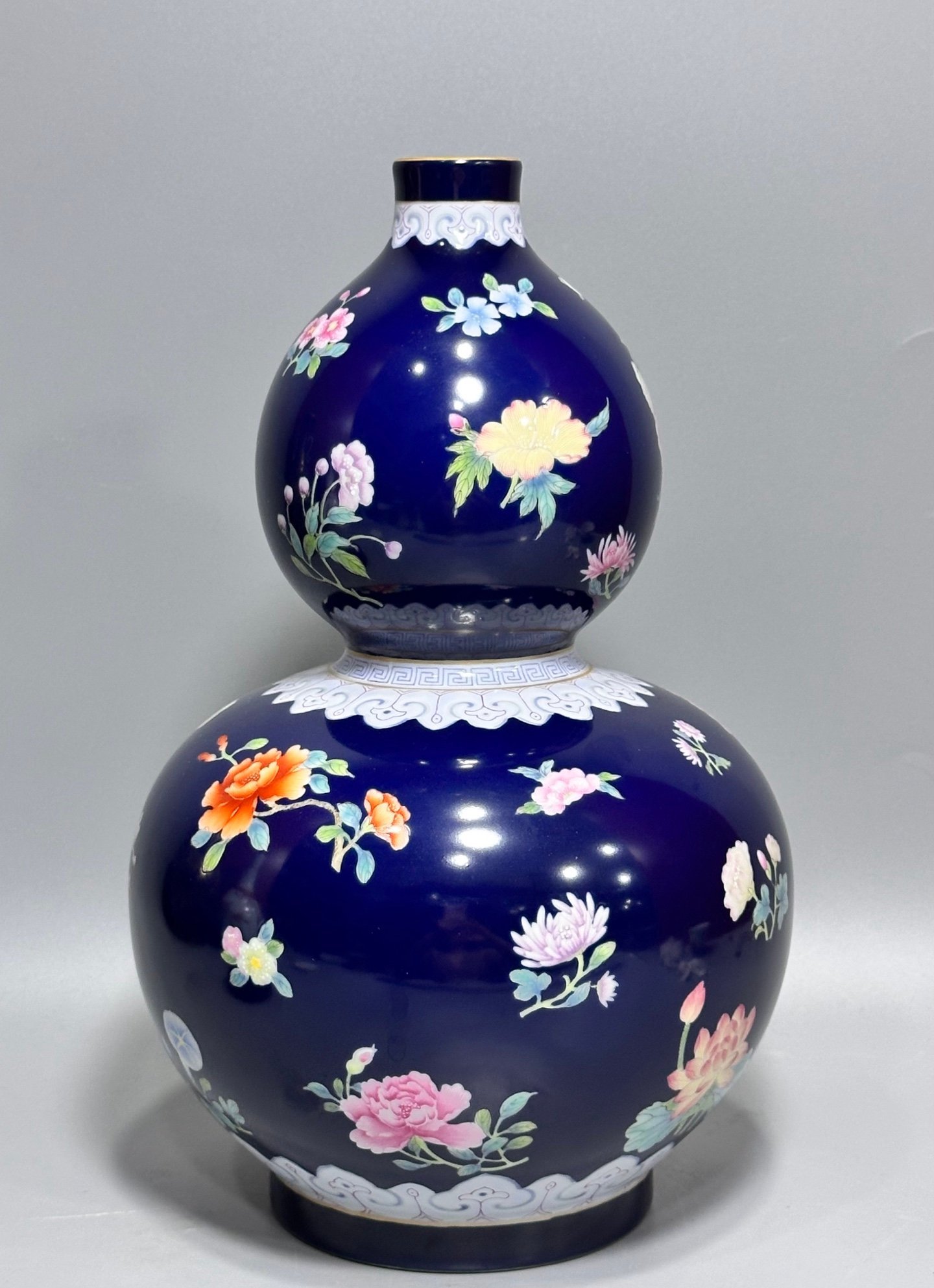 Qing Dynasty Qianlong blue-glazed pastel floral gourd vase