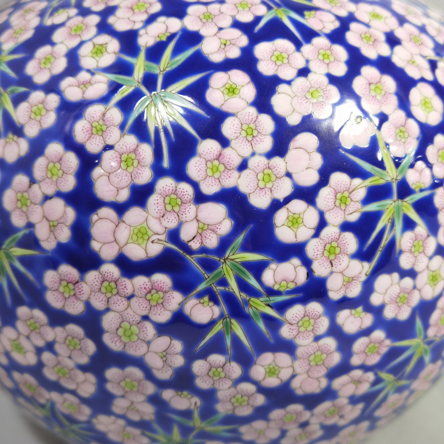 Qing Dynasty Daoguang Blue ground pastel plum and bamboo celestial sphere vase
