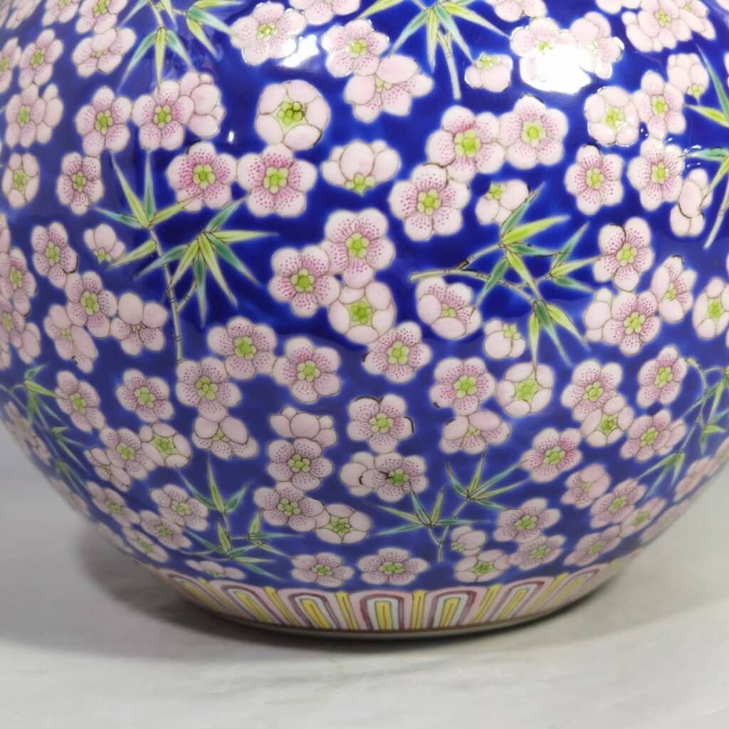 Qing Dynasty Daoguang Blue ground pastel plum and bamboo celestial sphere vase