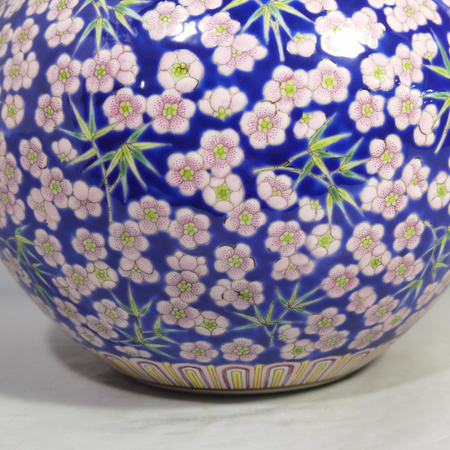 Qing Dynasty Daoguang Blue ground pastel plum and bamboo celestial sphere vase