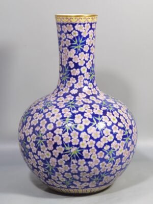 Qing Dynasty Daoguang Blue ground pastel plum and bamboo celestial sphere vase
