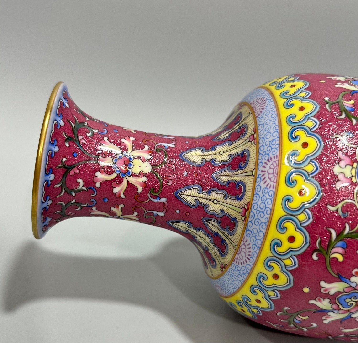 Qing Dynasty Qianlong enamel carmine track passion flower branch Guanyin vase