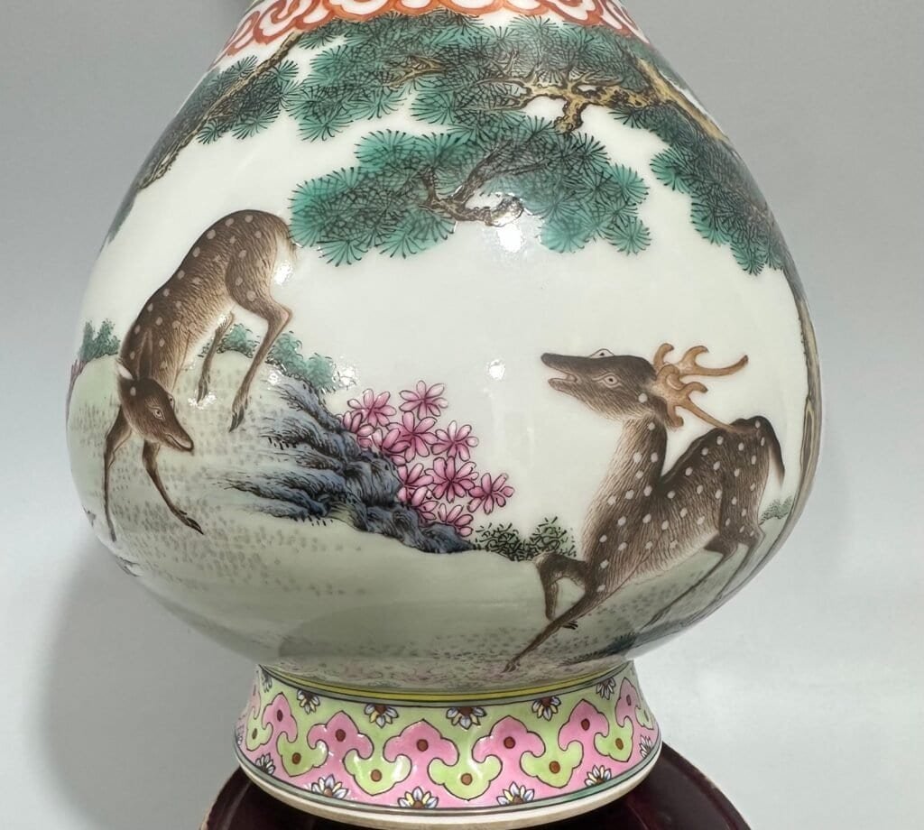 Qing Dynasty Qianlong pastel pine deer and crane garlic vase