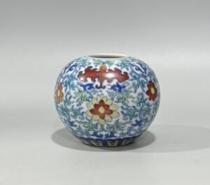 Qing Dynasty Yongzheng blue and white doucai bat flower and branch apple statue
