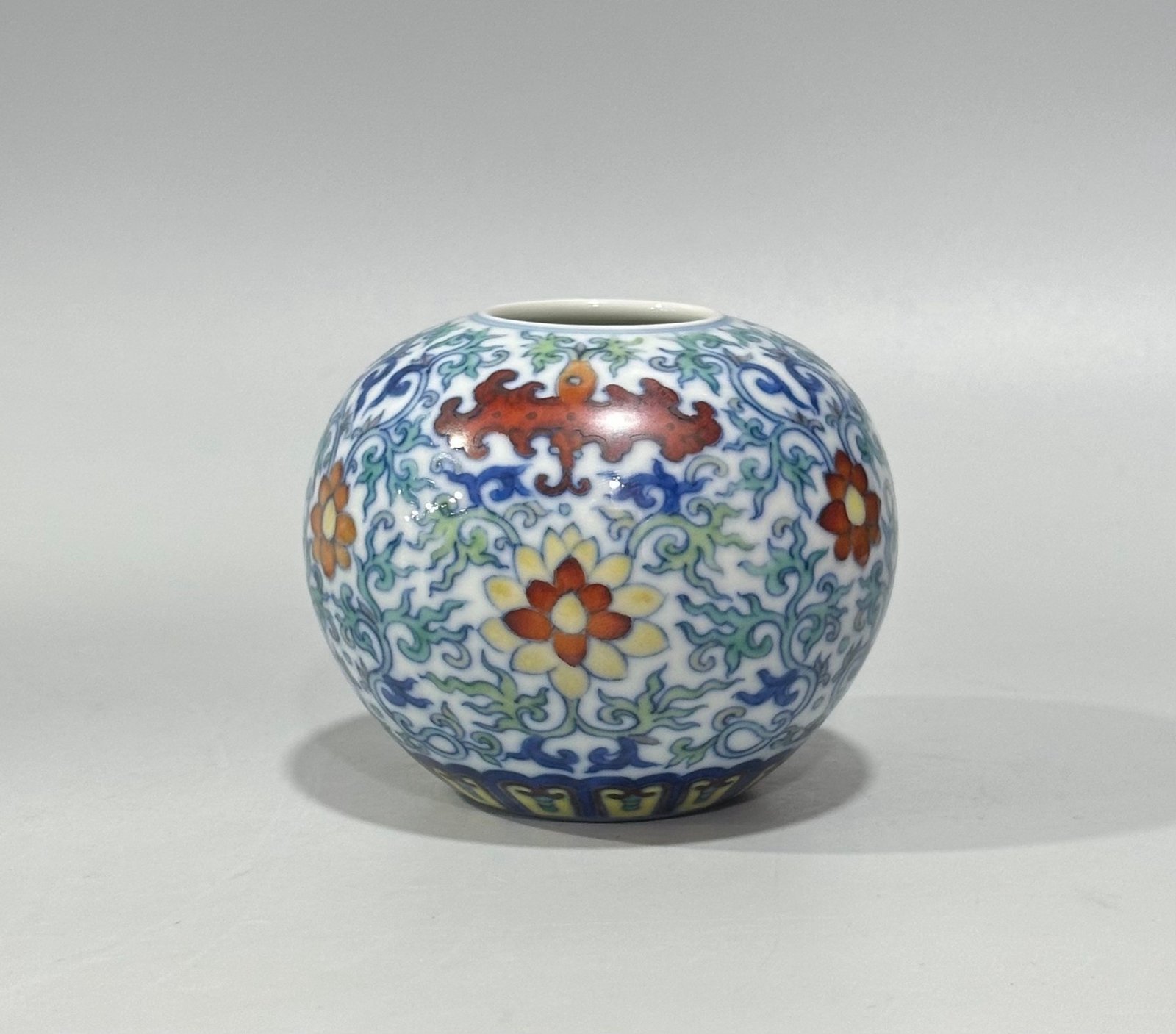 Qing Dynasty Yongzheng blue and white doucai bat flower and branch apple statue