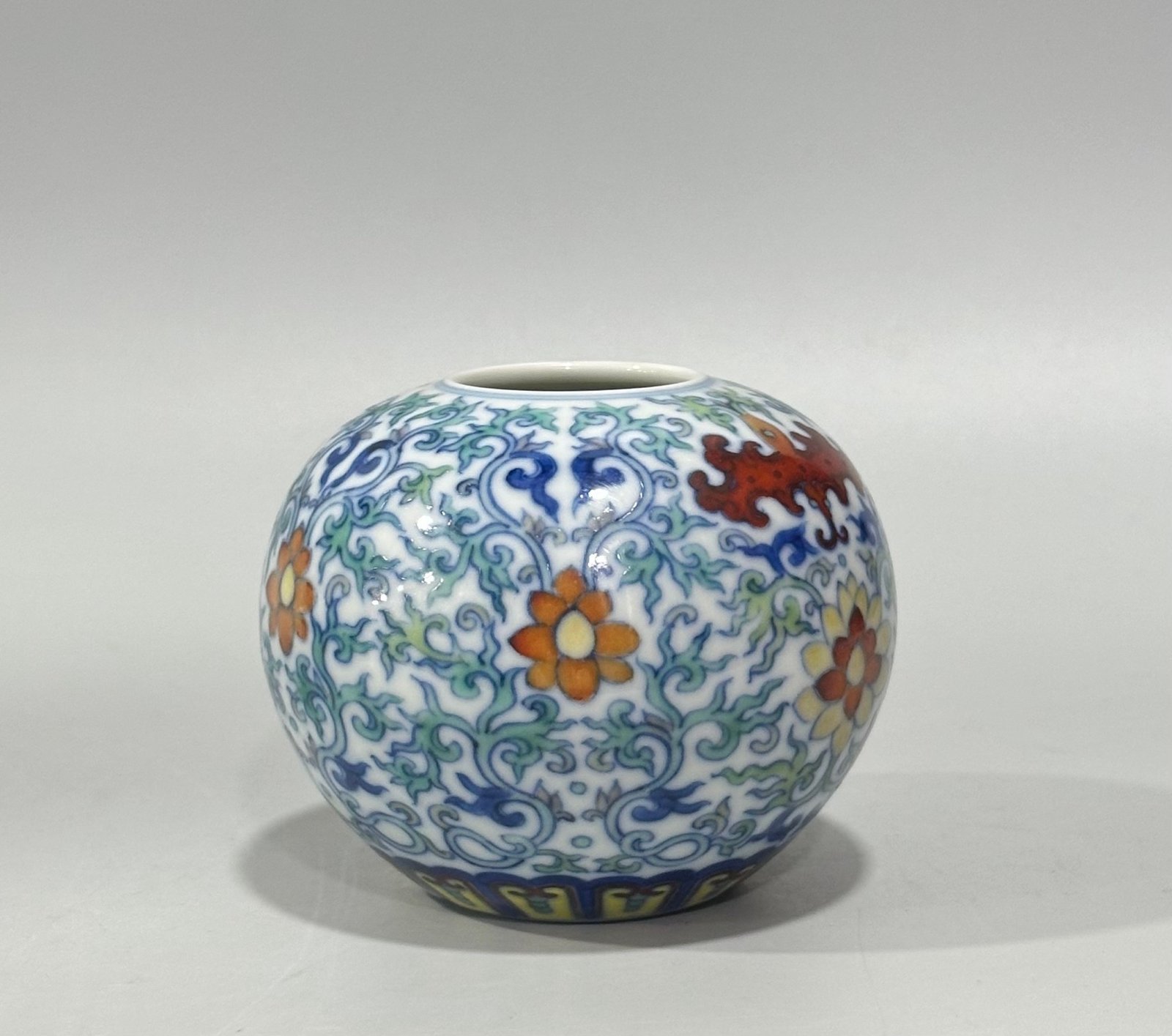 Qing Dynasty Yongzheng blue and white doucai bat flower and branch apple statue