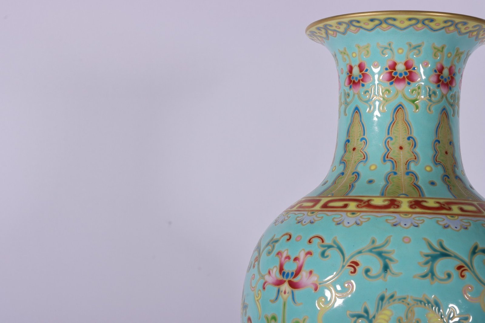 Qing Dynasty Qianlong enamel green ground and gold lotus Guanyin vase