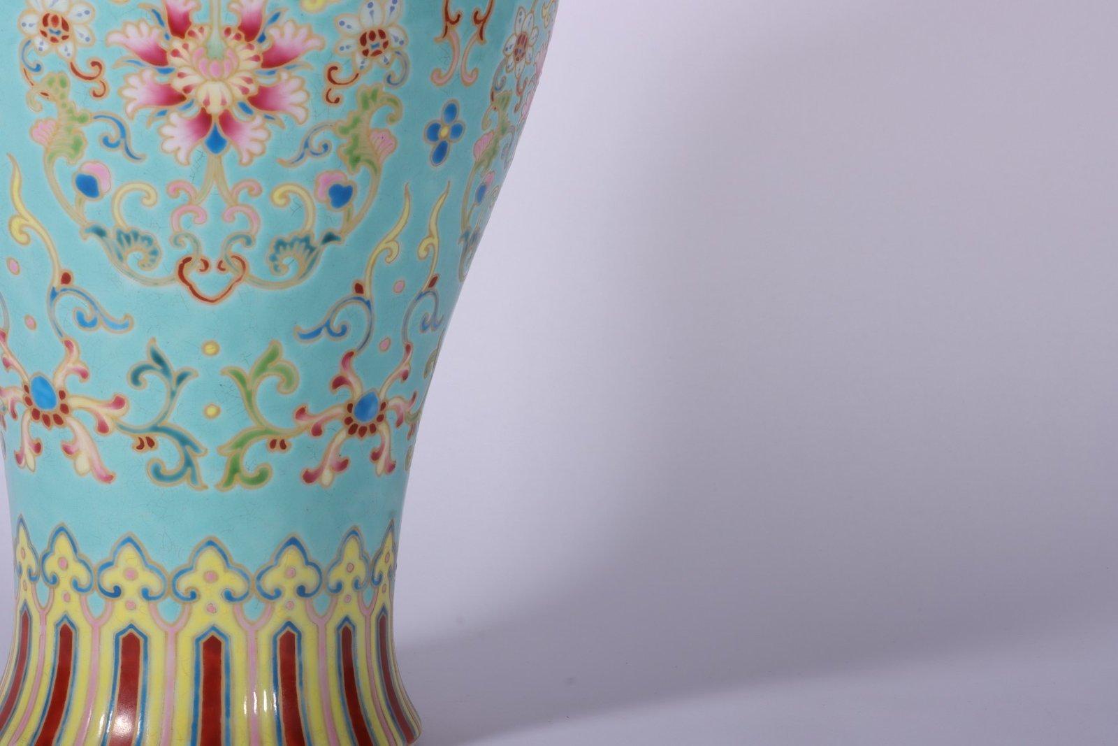 Qing Dynasty Qianlong enamel green ground and gold lotus Guanyin vase