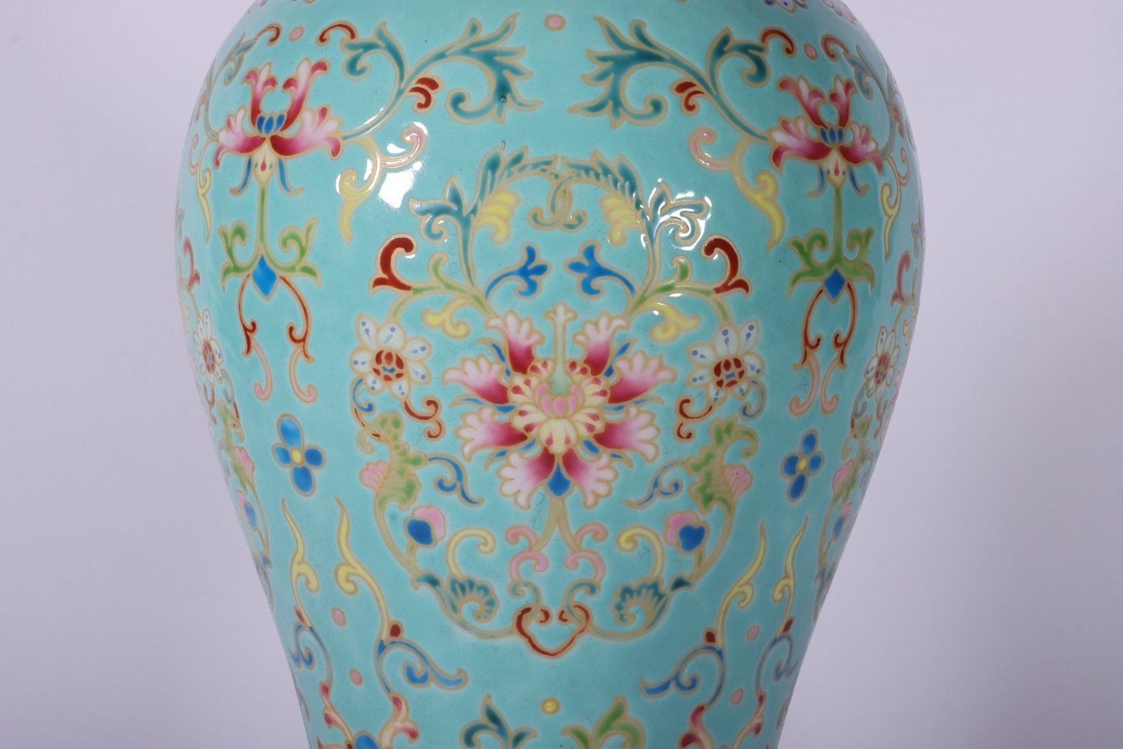 Qing Dynasty Qianlong enamel green ground and gold lotus Guanyin vase