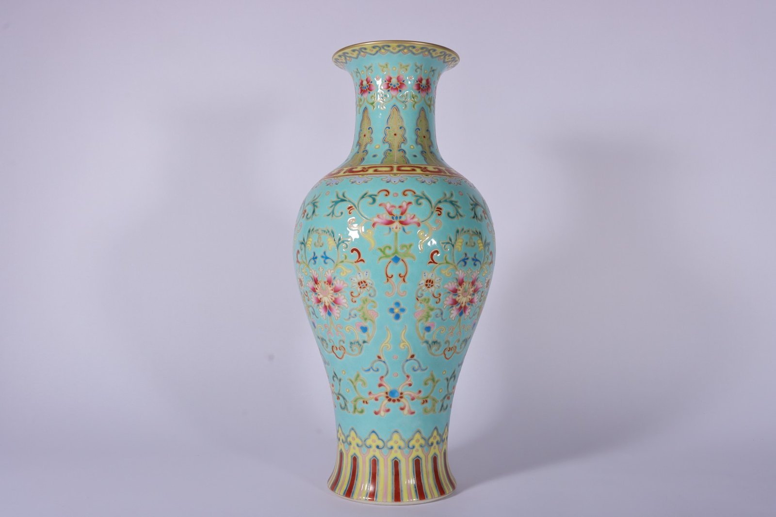 Qing Dynasty Qianlong enamel green ground and gold lotus Guanyin vase