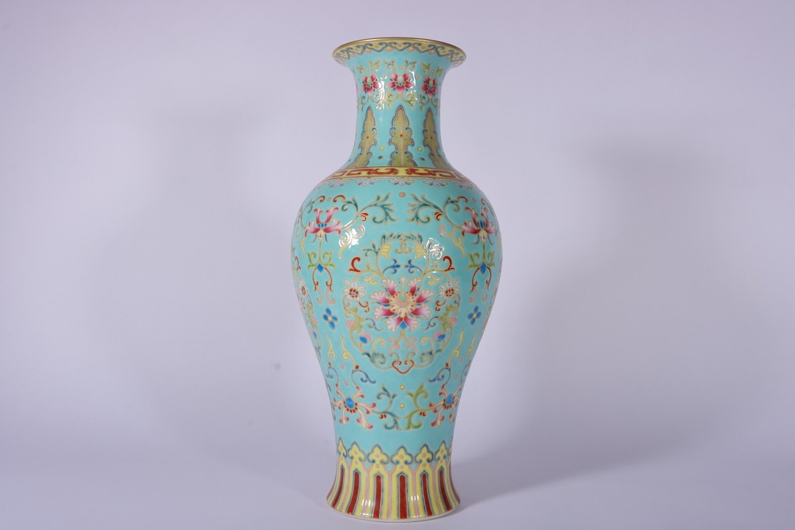 Qing Dynasty Qianlong enamel green ground and gold lotus Guanyin vase