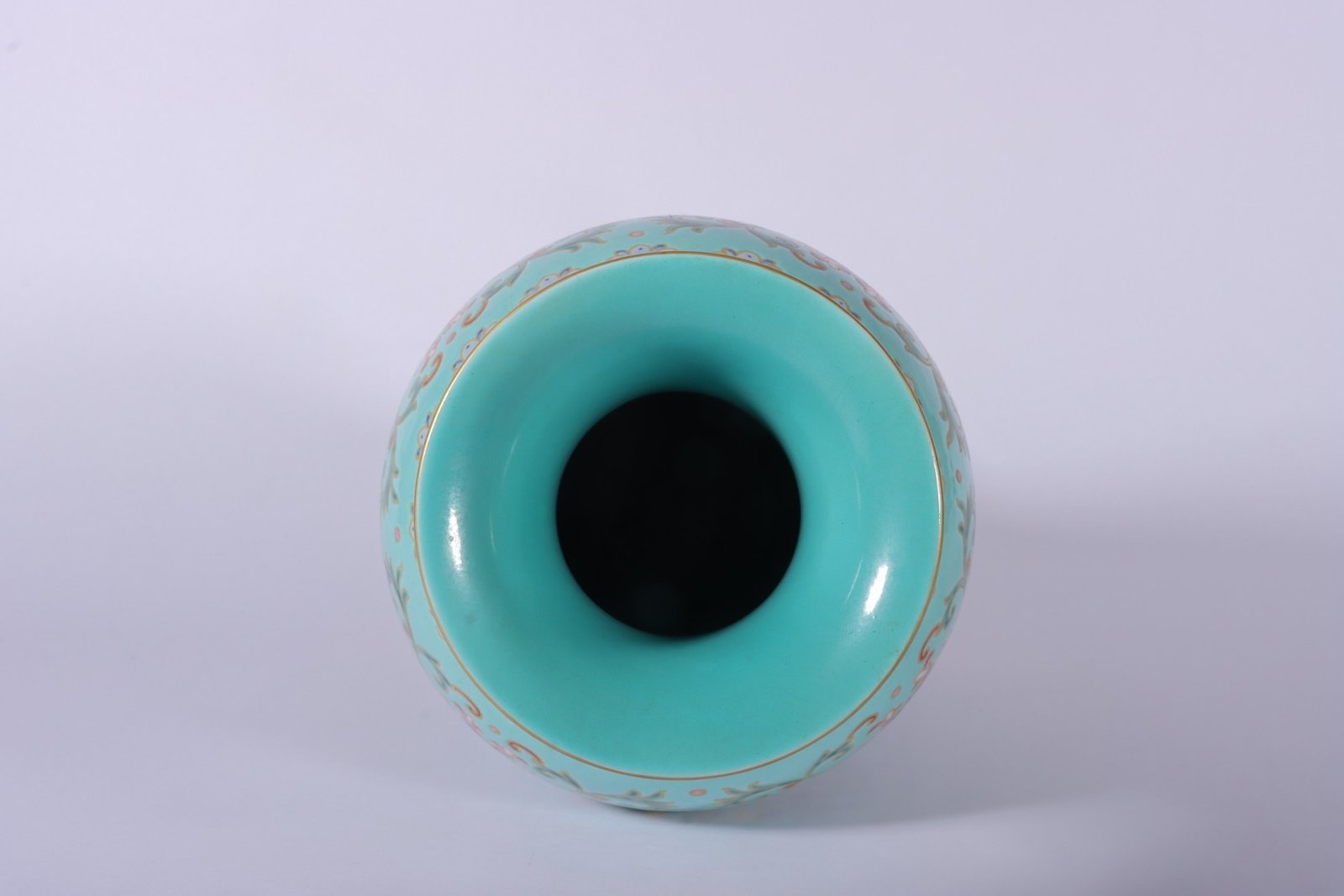 Qing Dynasty Qianlong enamel green ground and gold lotus Guanyin vase