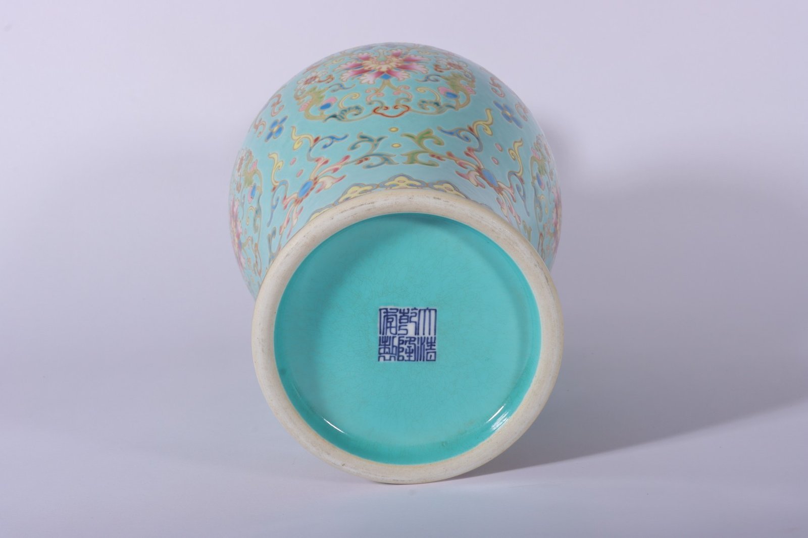 Qing Dynasty Qianlong enamel green ground and gold lotus Guanyin vase