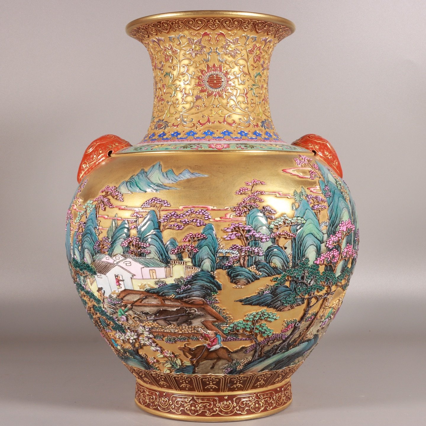 Qing Dynasty Qianlong enamel-carved gold landscape lion-ear vase