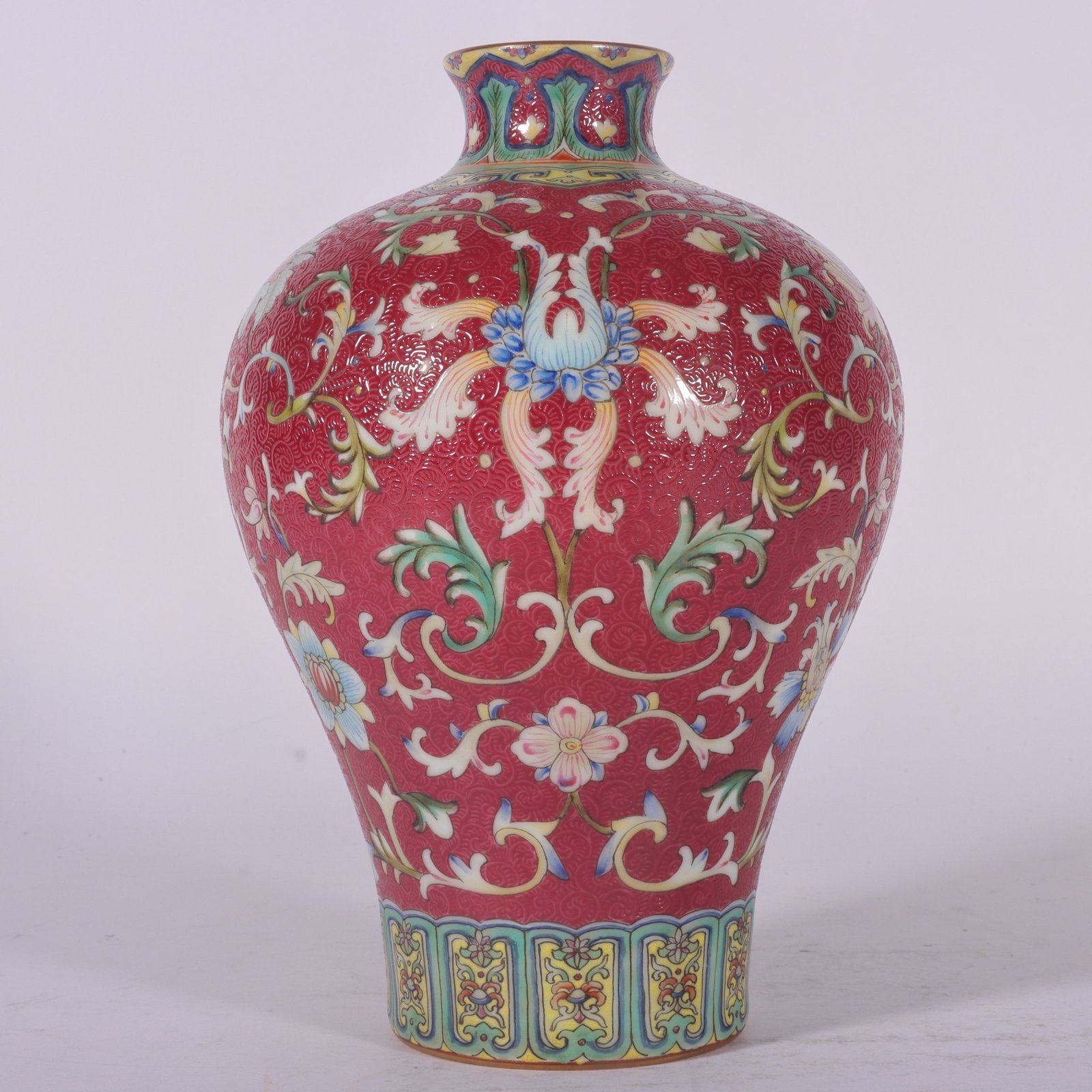 Qing Dynasty Qianlong famille rose and rouge red rolled lotus and plum vase