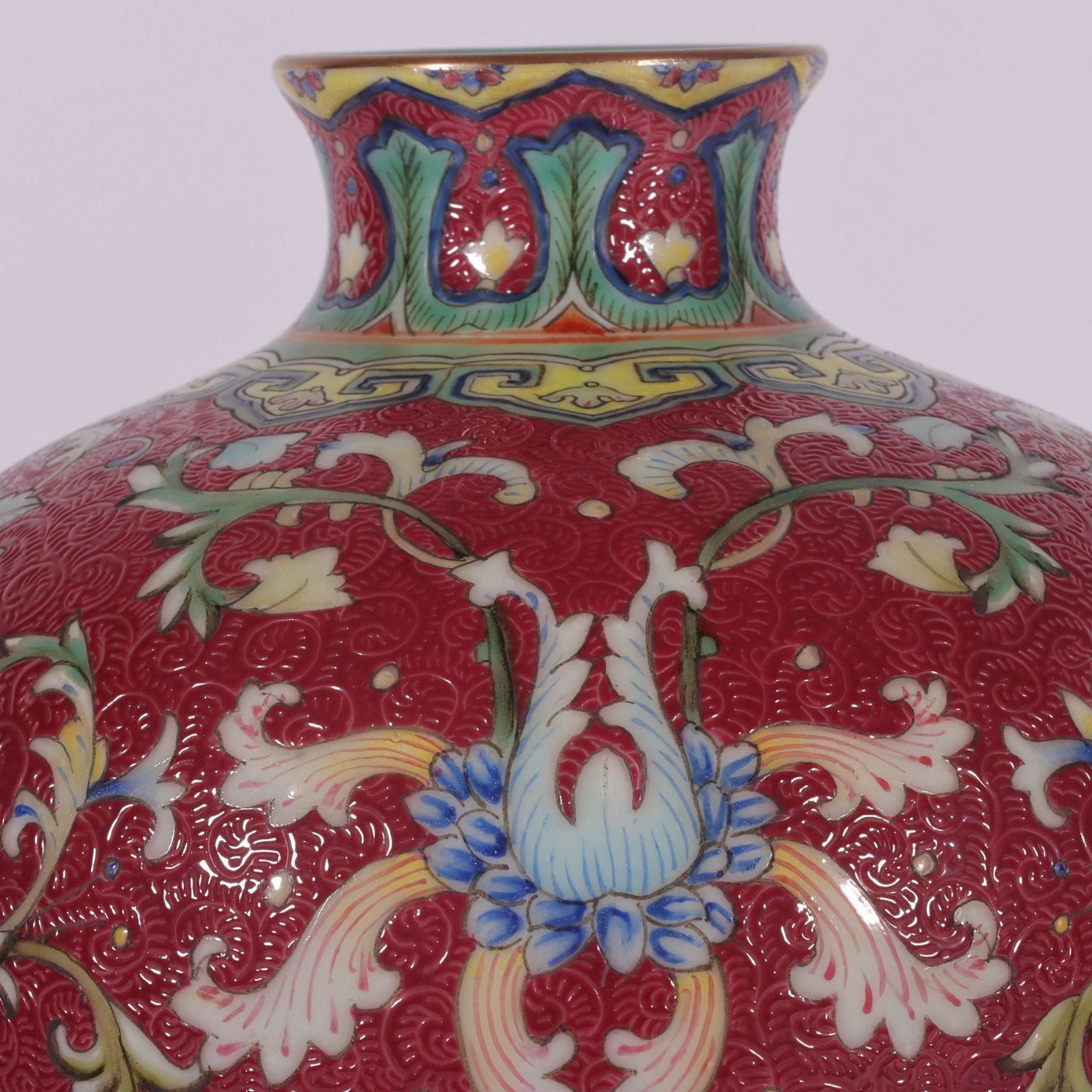 Qing Dynasty Qianlong famille rose and rouge red rolled lotus and plum vase