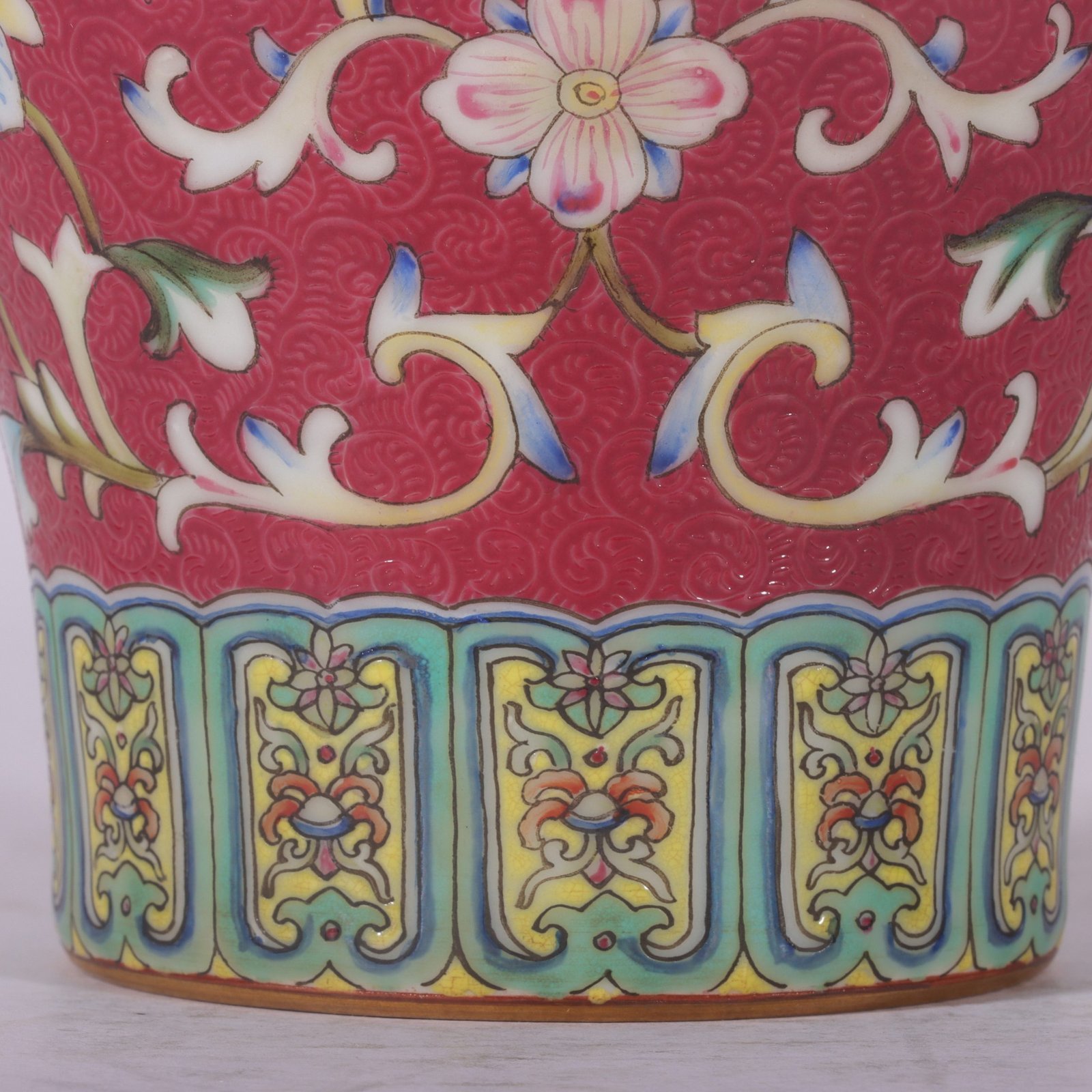 Qing Dynasty Qianlong famille rose and rouge red rolled lotus and plum vase