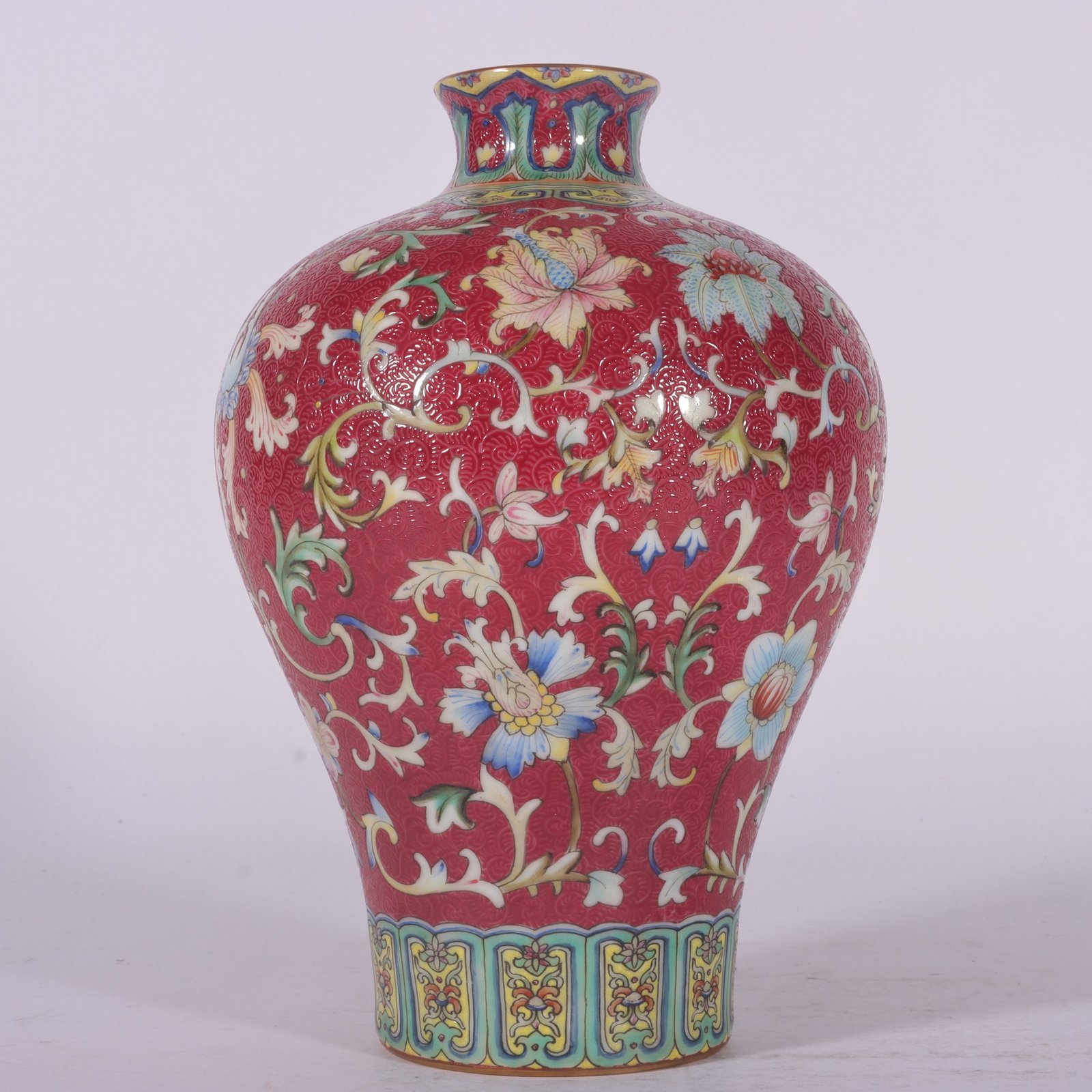 Qing Dynasty Qianlong famille rose and rouge red rolled lotus and plum vase