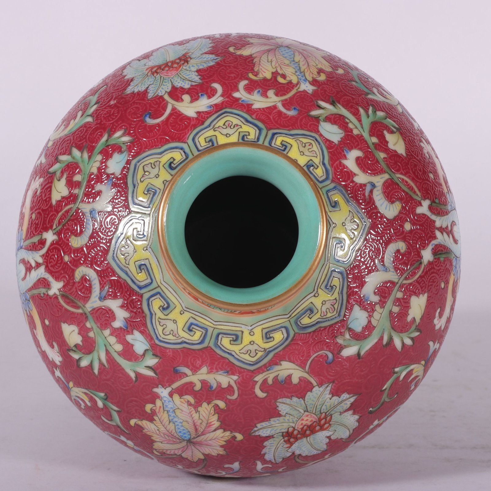 Qing Dynasty Qianlong famille rose and rouge red rolled lotus and plum vase