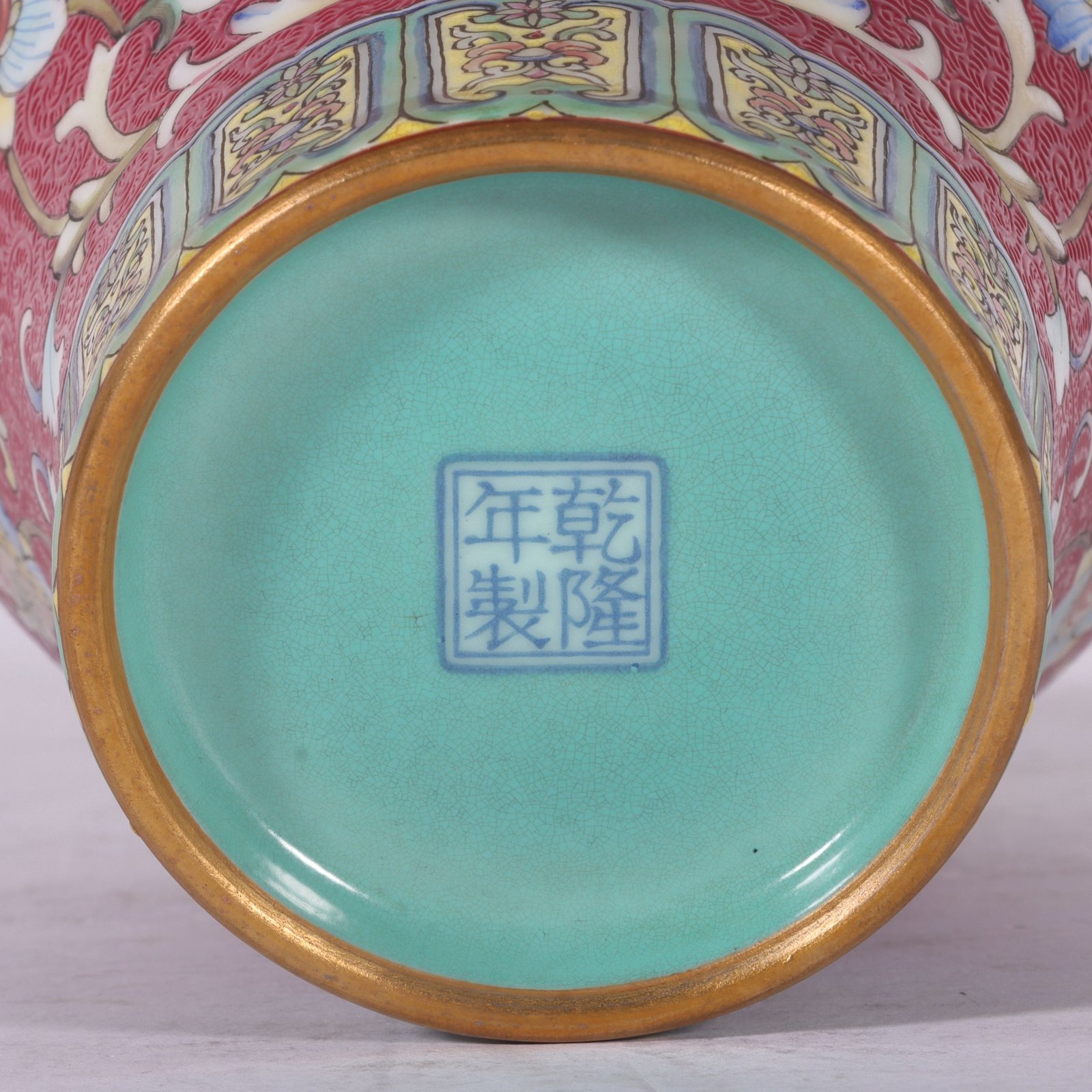 Qing Dynasty Qianlong famille rose and rouge red rolled lotus and plum vase