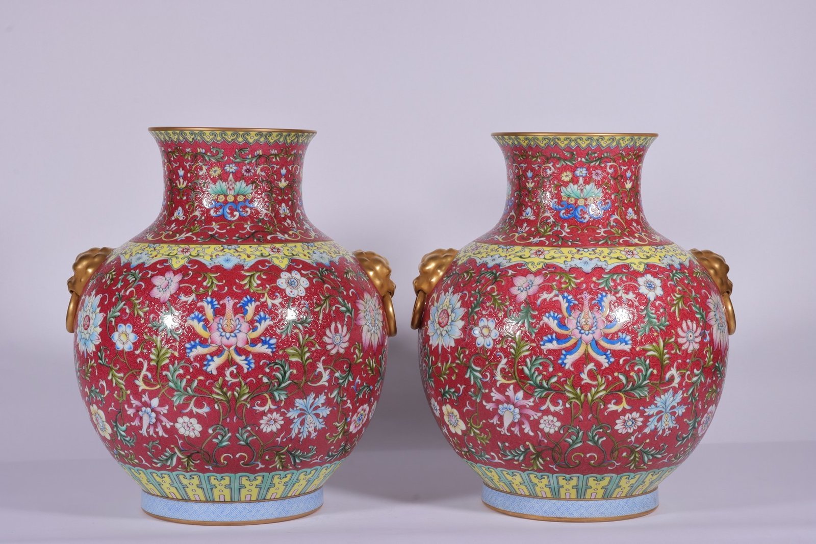 Qing Dynasty Qianlong famille rose and rouge red lotus and lion ear vase