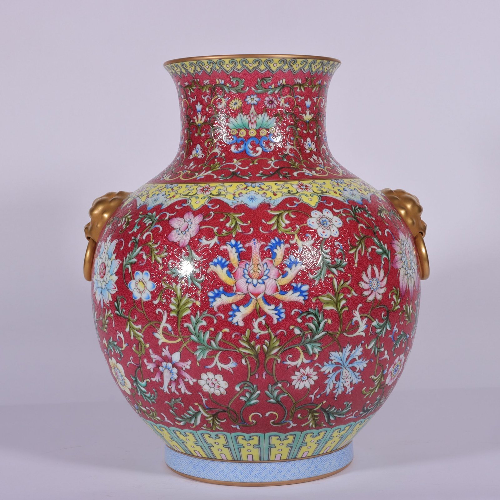Qing Dynasty Qianlong famille rose and rouge red lotus and lion ear vase