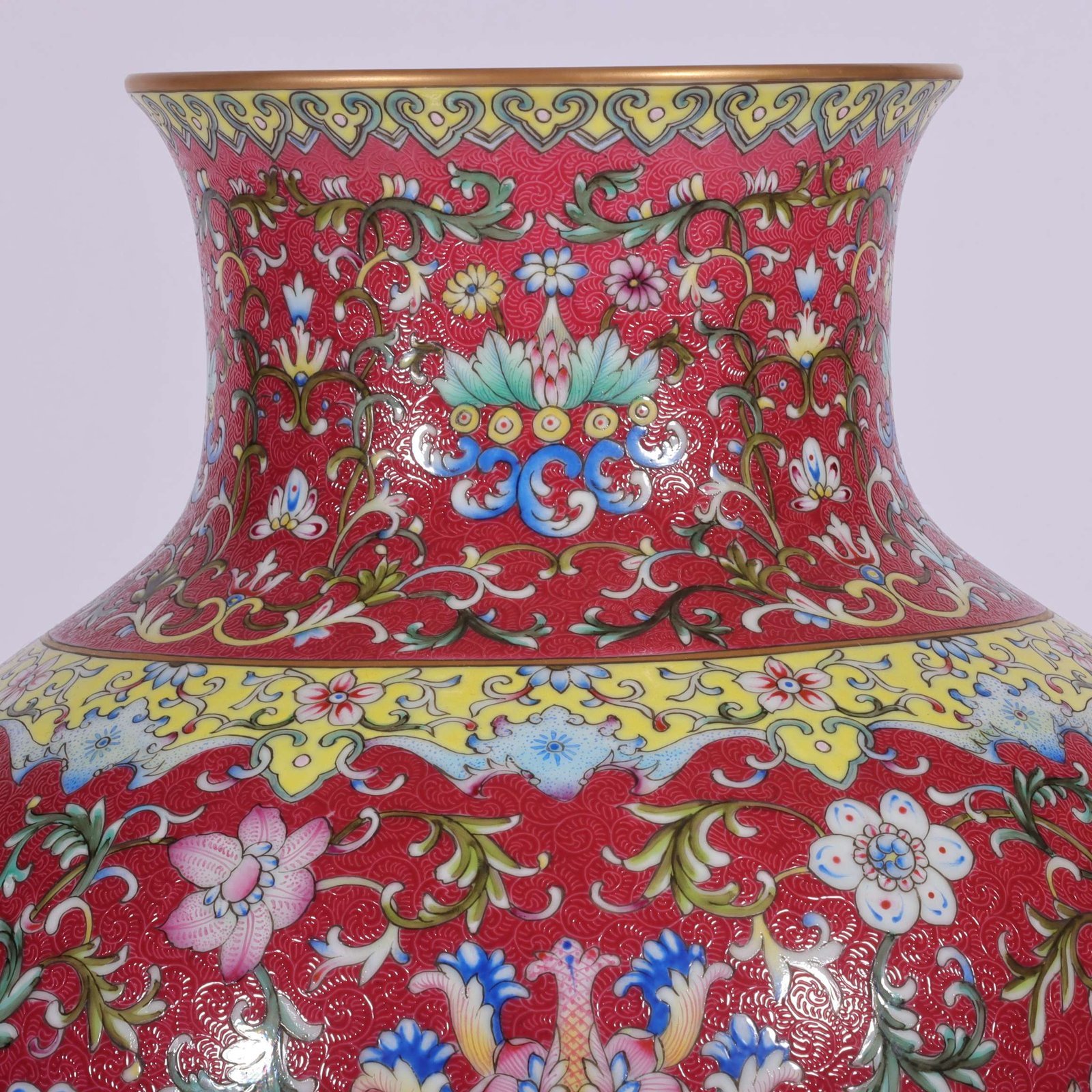 Qing Dynasty Qianlong famille rose and rouge red lotus and lion ear vase