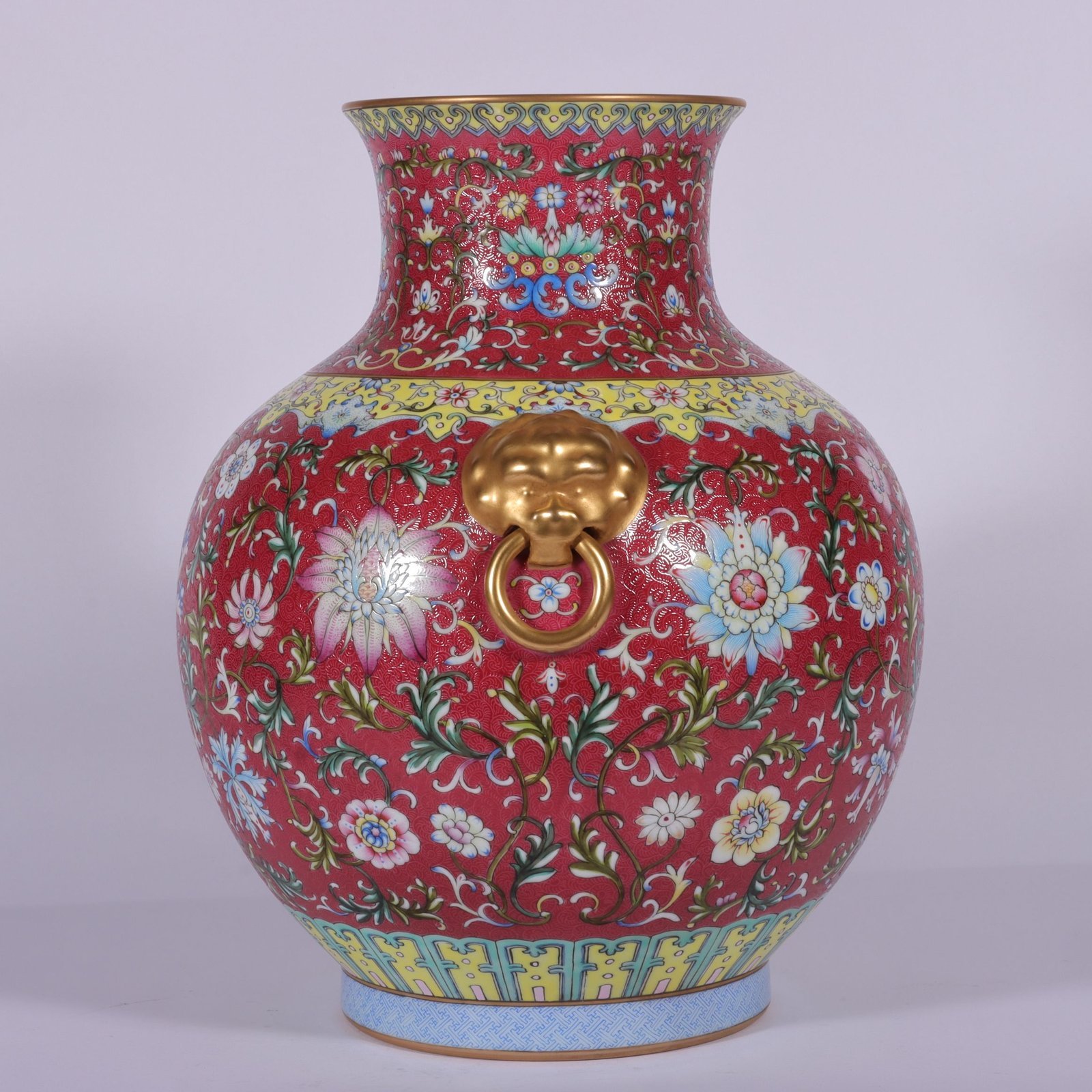 Qing Dynasty Qianlong famille rose and rouge red lotus and lion ear vase