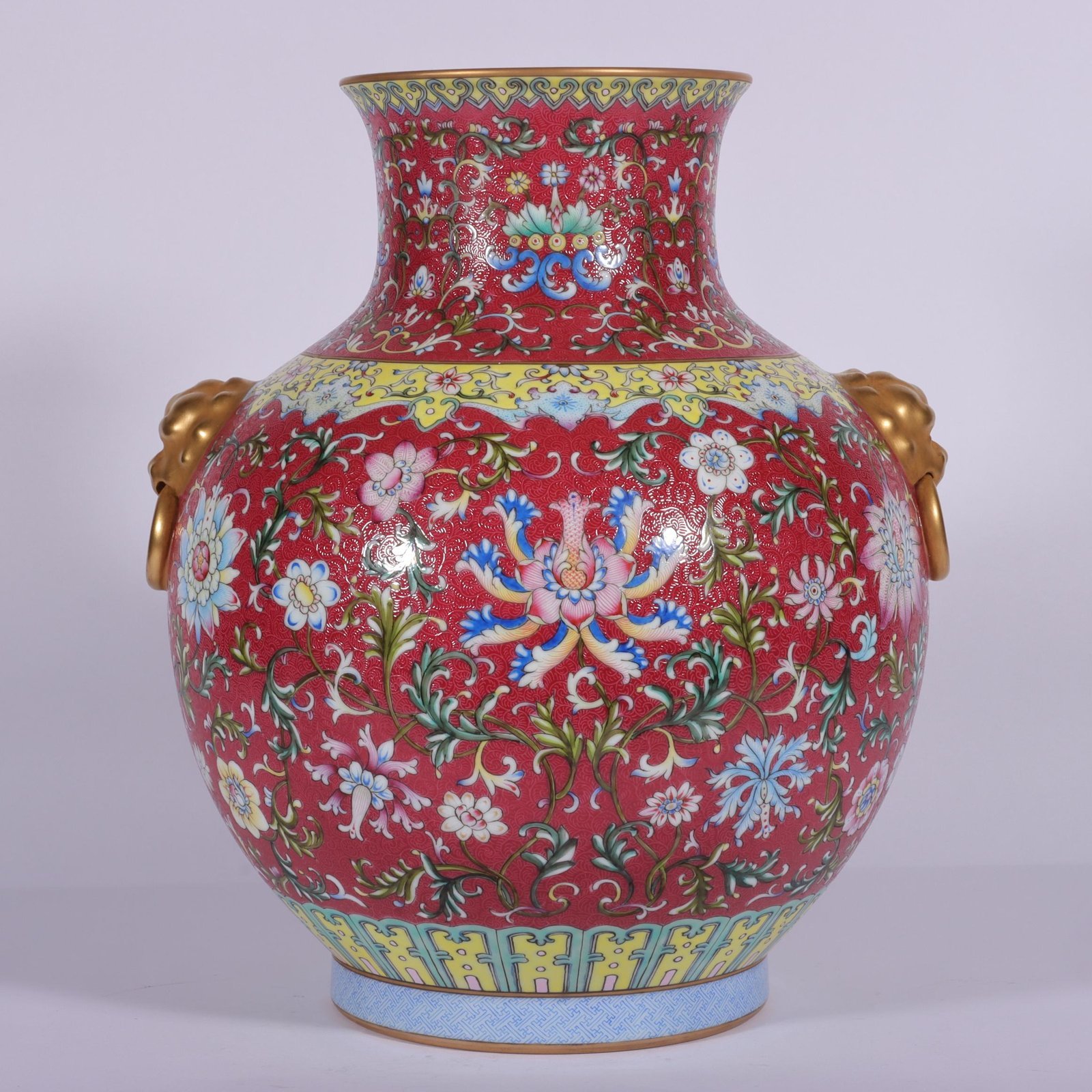 Qing Dynasty Qianlong famille rose and rouge red lotus and lion ear vase
