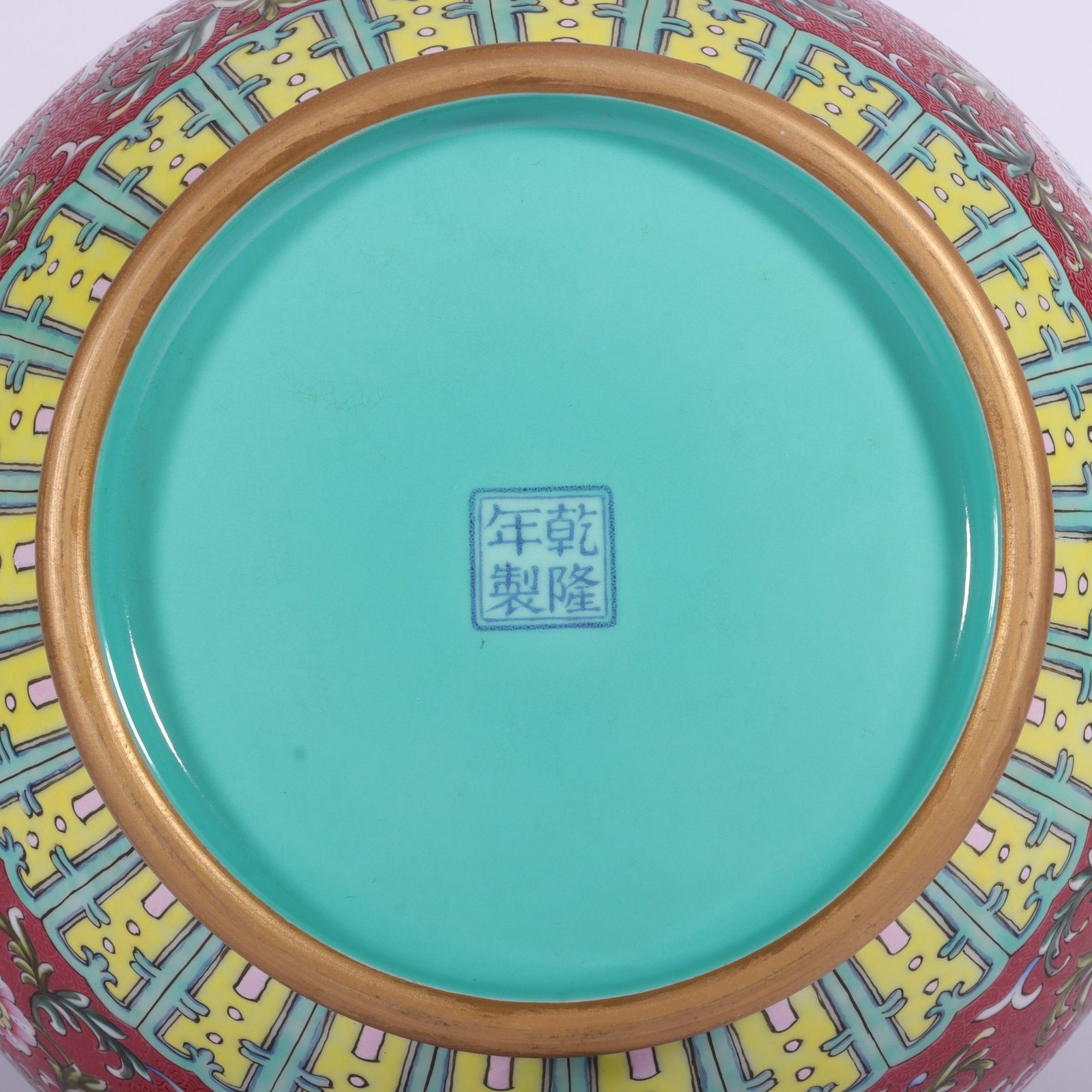 Qing Dynasty Qianlong famille rose and rouge red lotus and lion ear vase