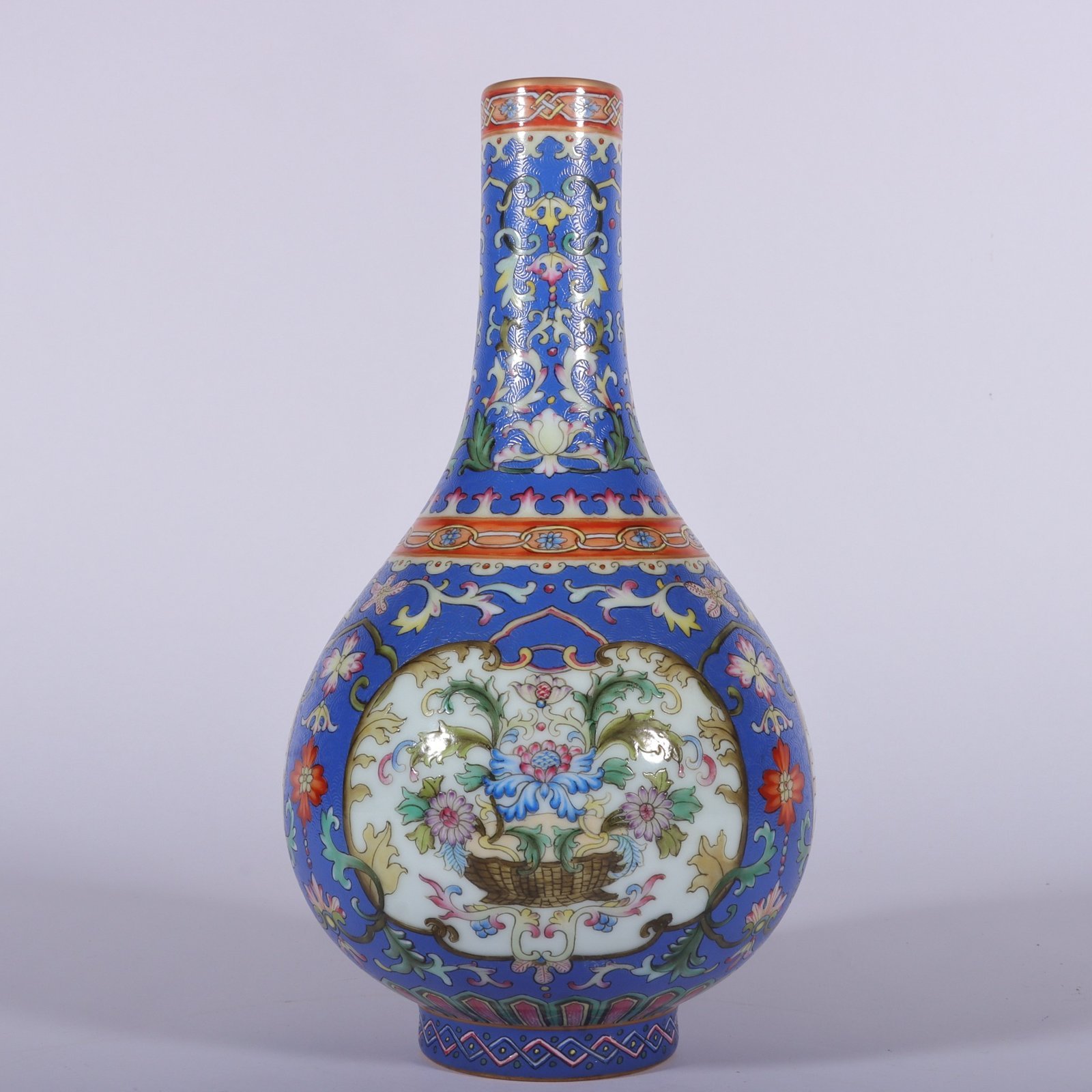 Qing Dynasty Qianlong famille rose blue ground rolled window vase