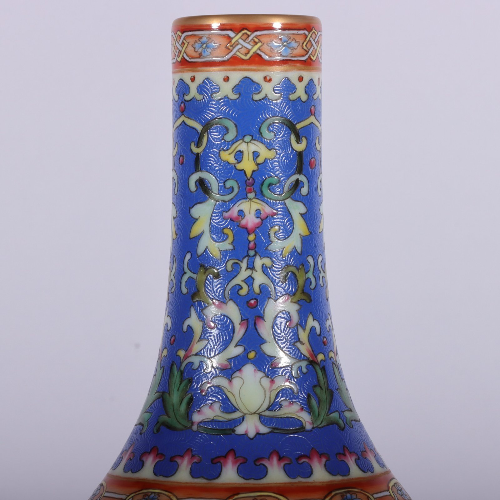 Qing Dynasty Qianlong famille rose blue ground rolled window vase