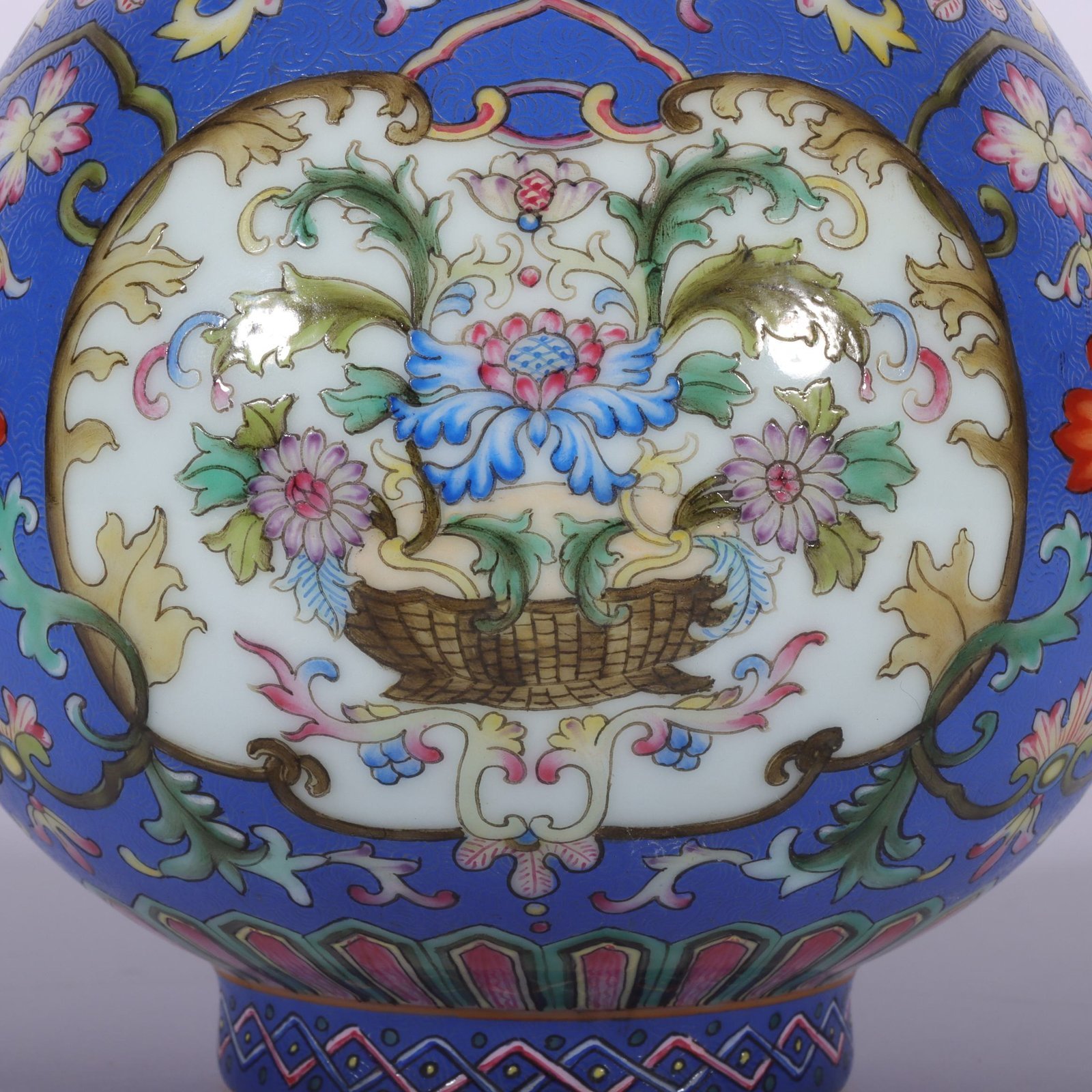 Qing Dynasty Qianlong famille rose blue ground rolled window vase