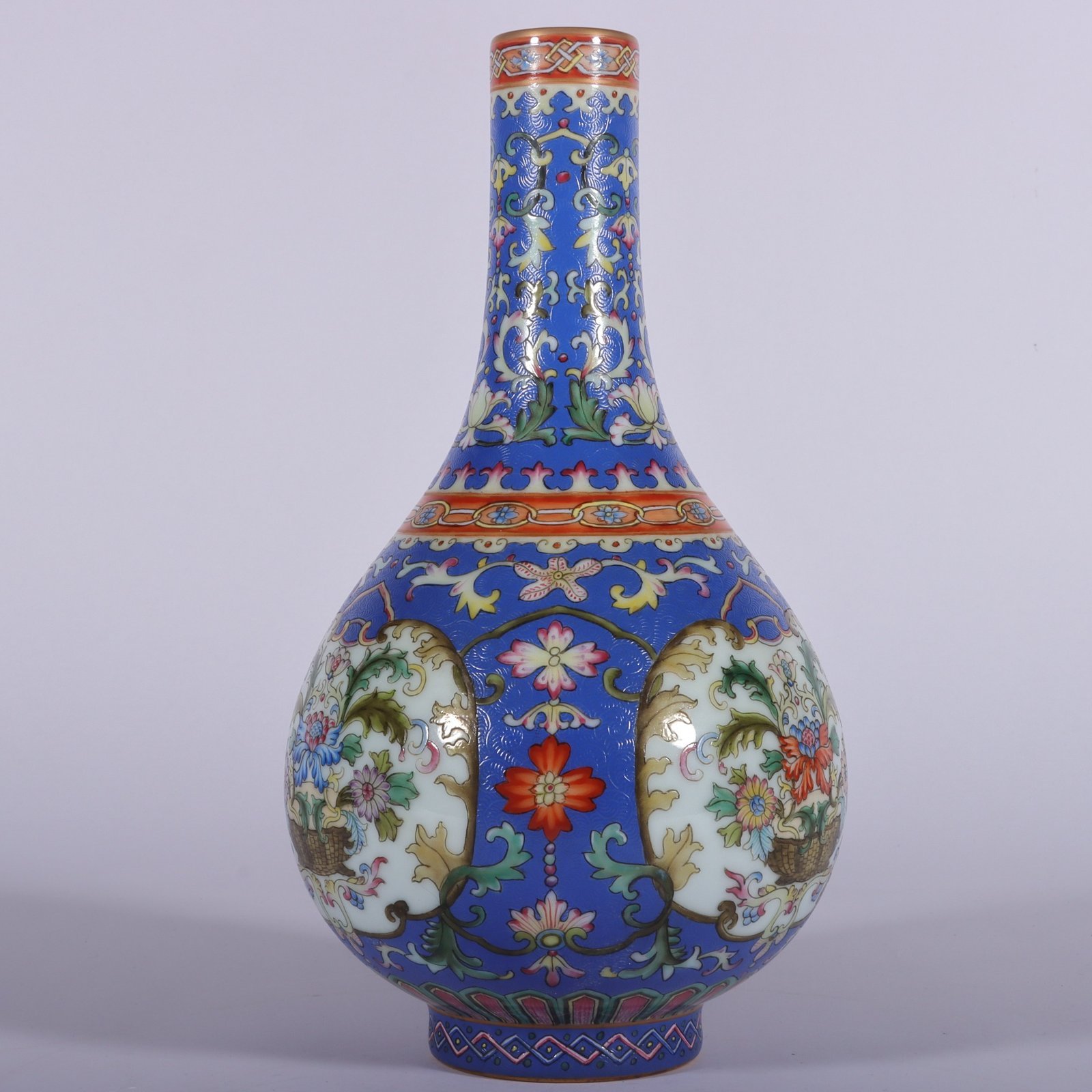 Qing Dynasty Qianlong famille rose blue ground rolled window vase