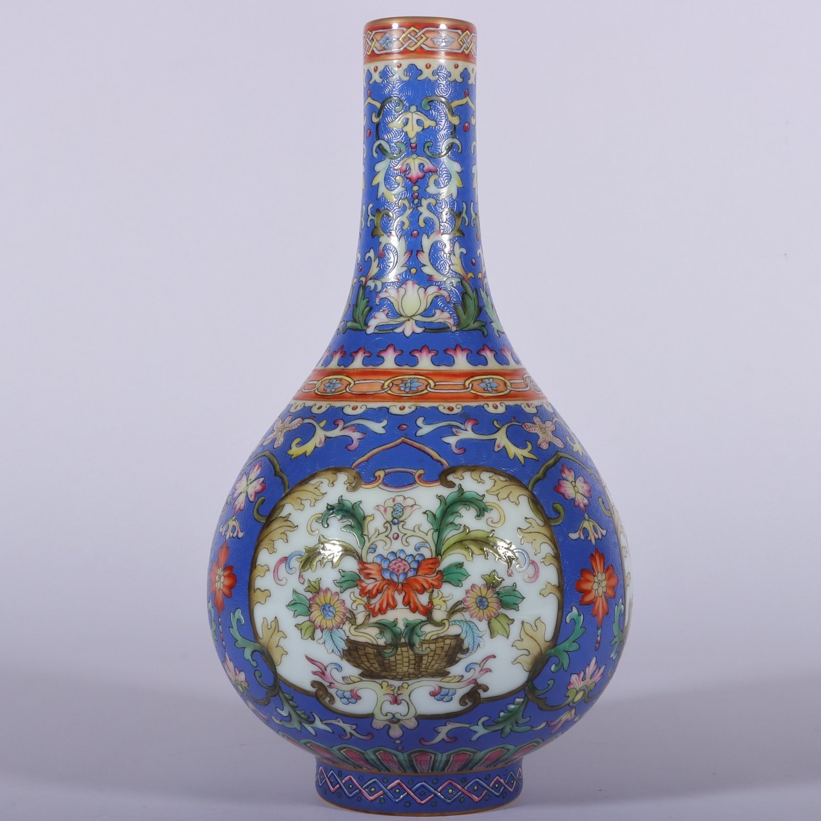 Qing Dynasty Qianlong famille rose blue ground rolled window vase