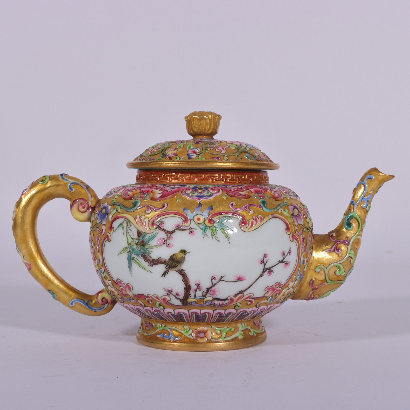 Qing Dynasty Qianlong enamel-carved gilded lotus flower and bird vase with window