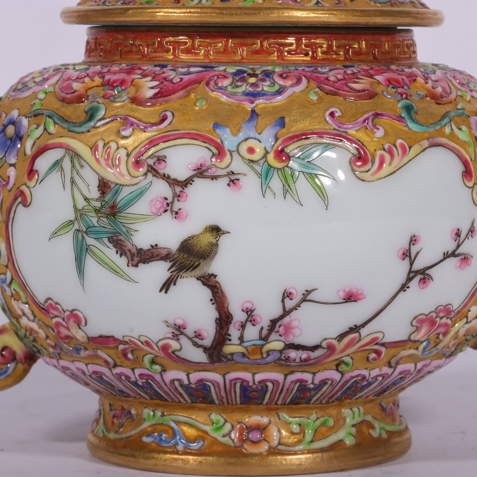 Qing Dynasty Qianlong enamel-carved gilded lotus flower and bird vase with window