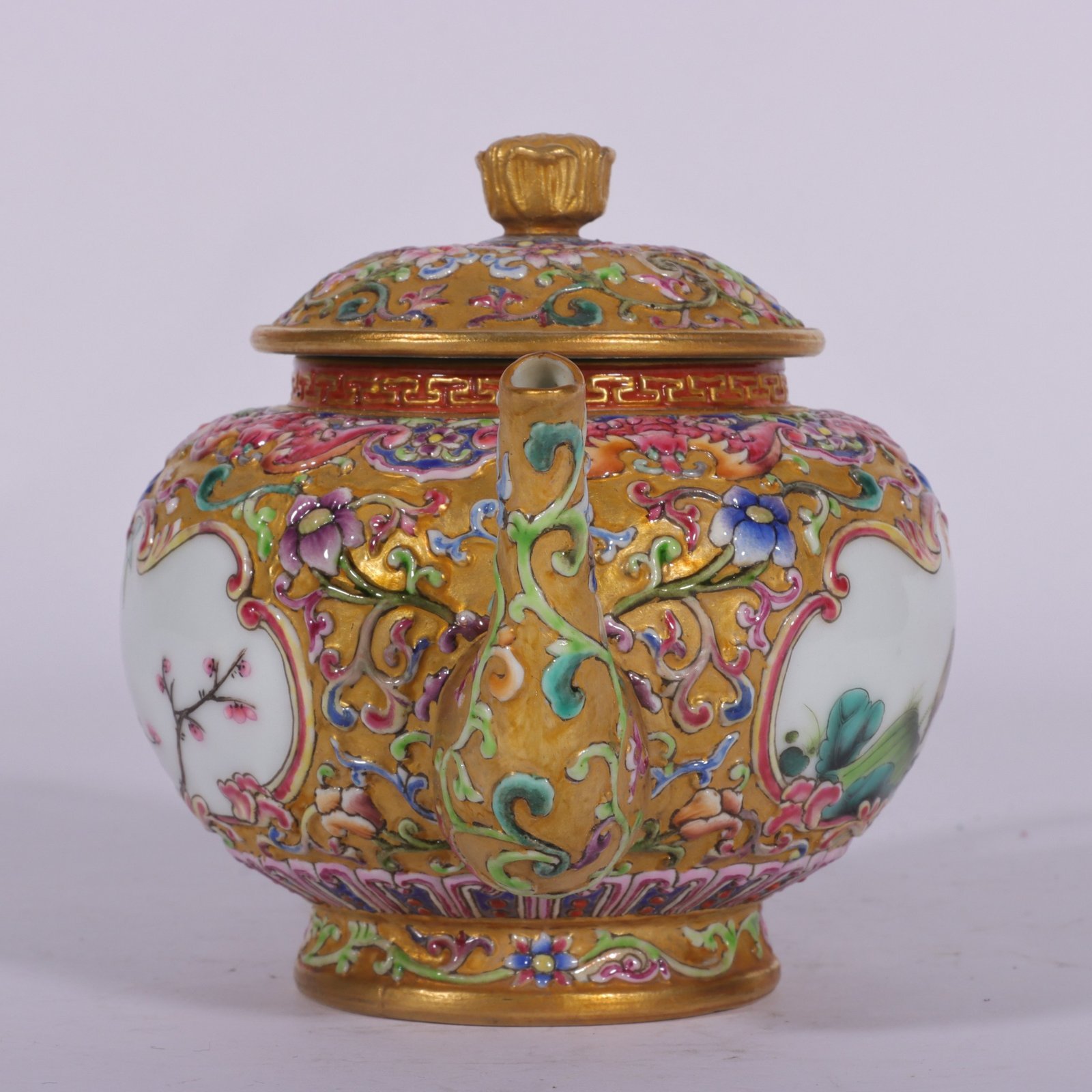 Qing Dynasty Qianlong enamel-carved gilded lotus flower and bird vase with window