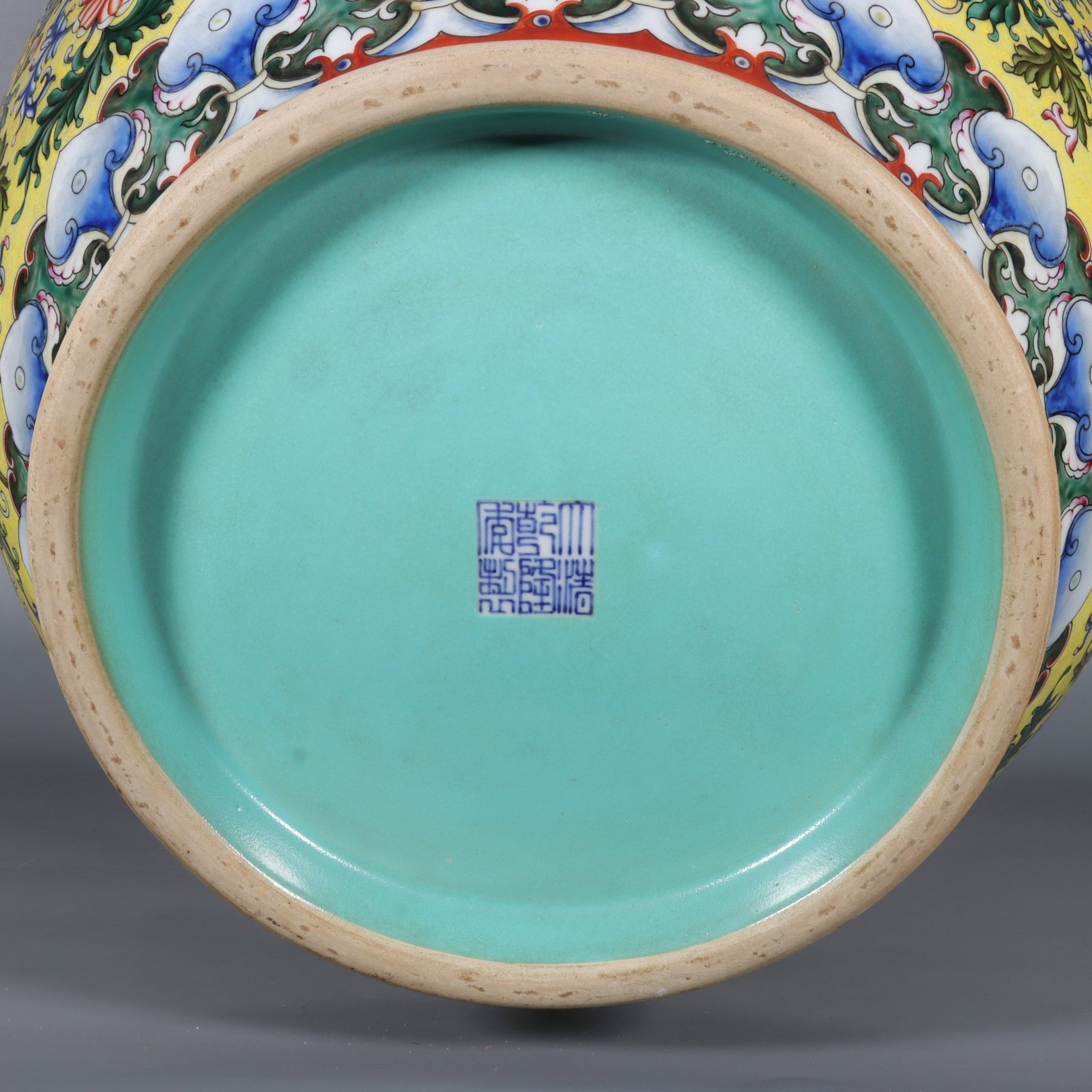 Qing Dynasty Qianlong yellow ground pastel gilded lion-eared vase with lotus flowers