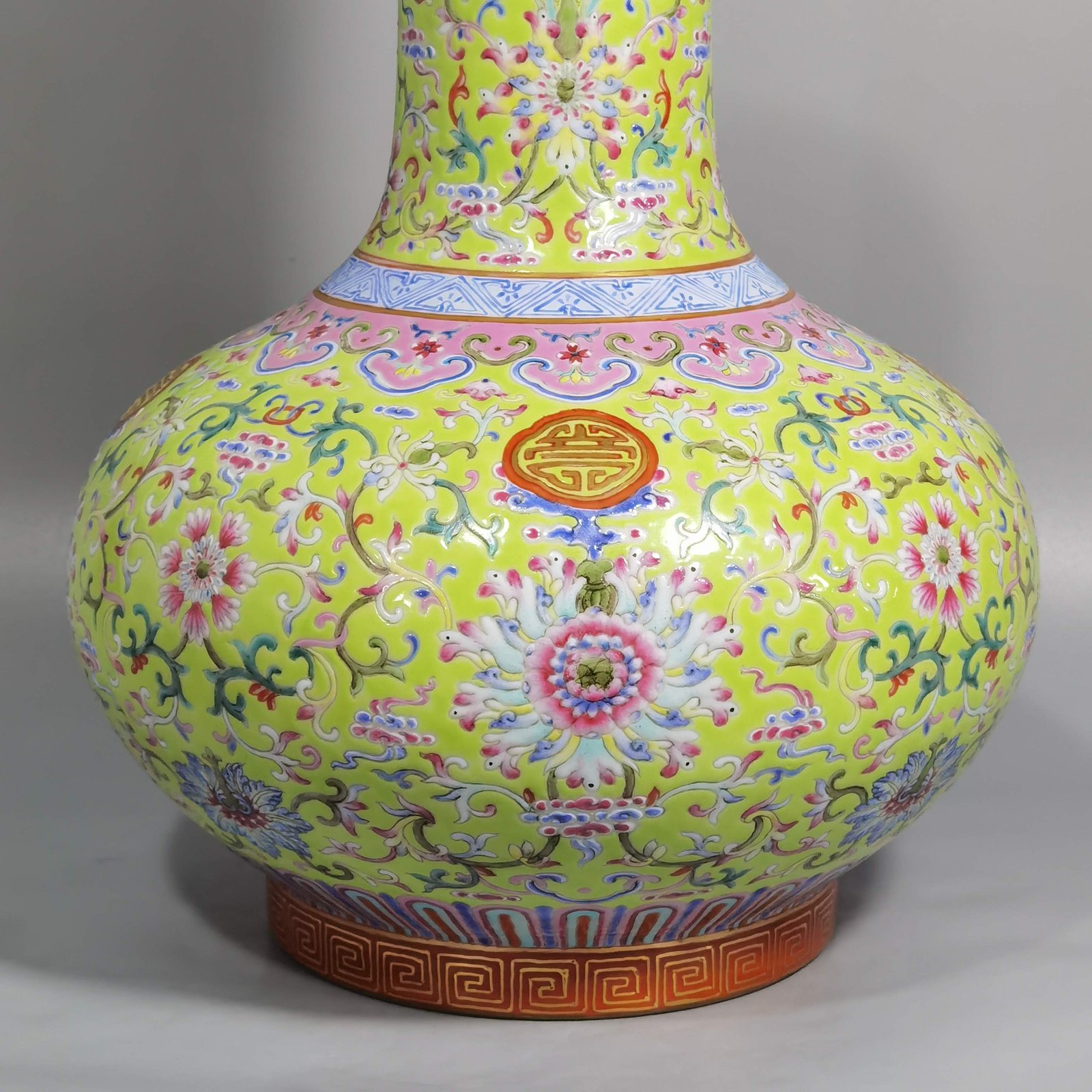 Qing Dynasty Qianlong walnut green land famille rose Fucun celestial sphere vase
