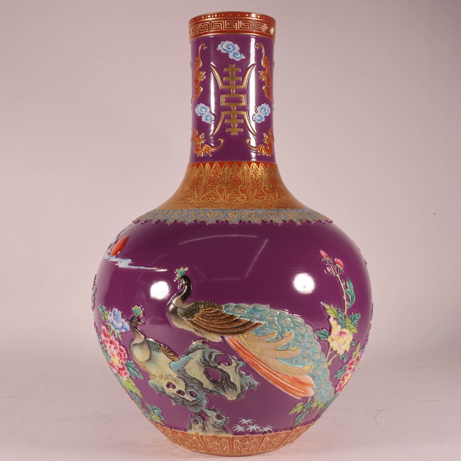 Qing Dynasty Qianlong enamel purple ground carved gold phoenix celestial sphere vase