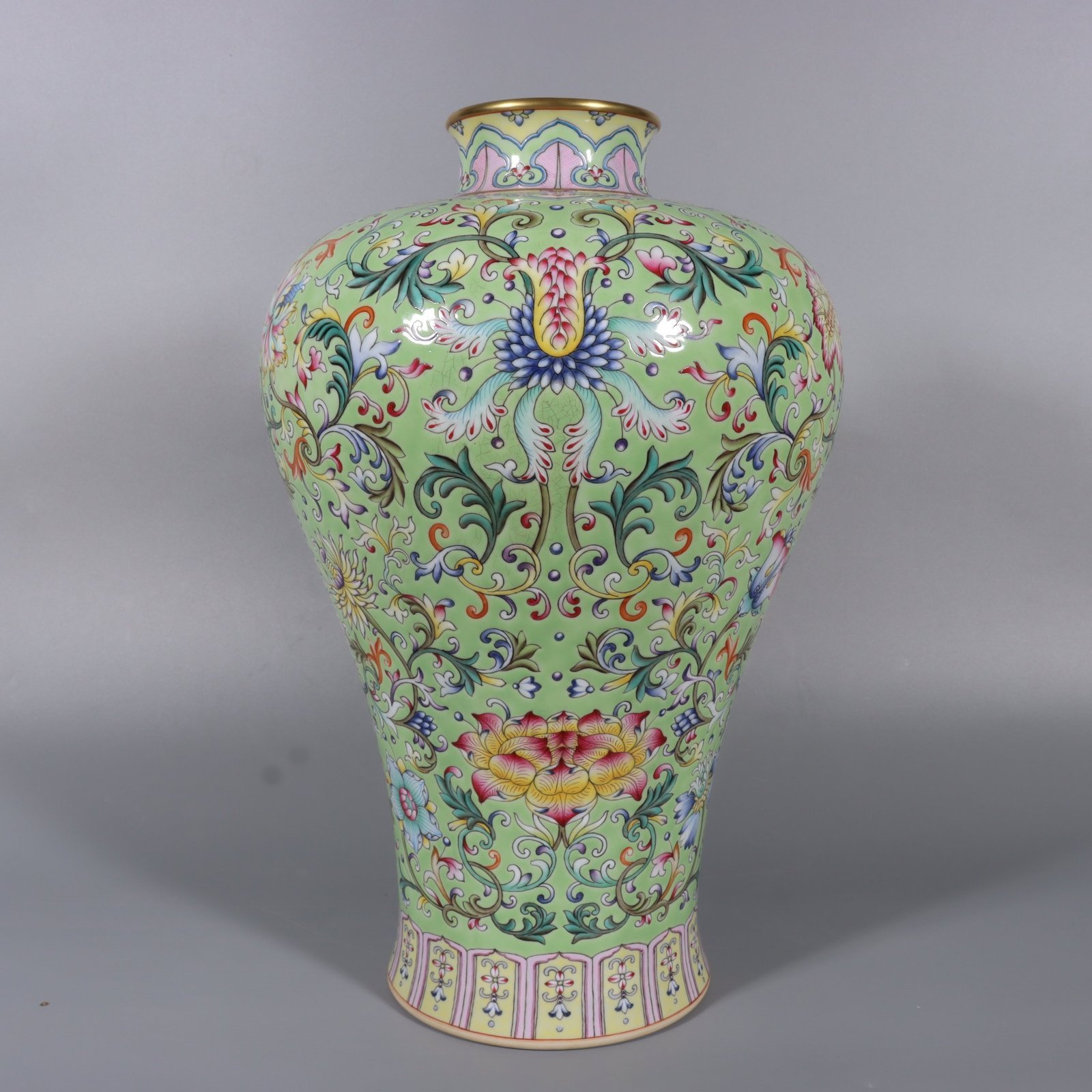 Qing Dynasty Qianlong pair of pastel turquoise and green ground lotus and plum vases