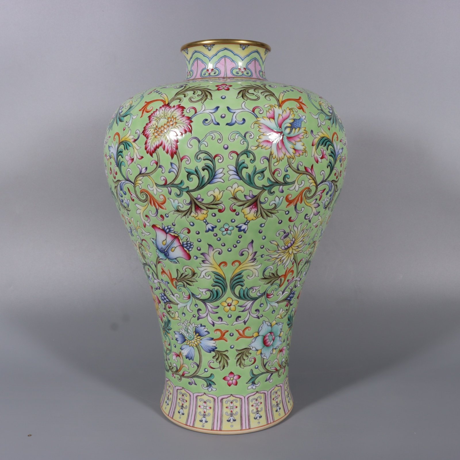 Qing Dynasty Qianlong pair of pastel turquoise and green ground lotus and plum vases
